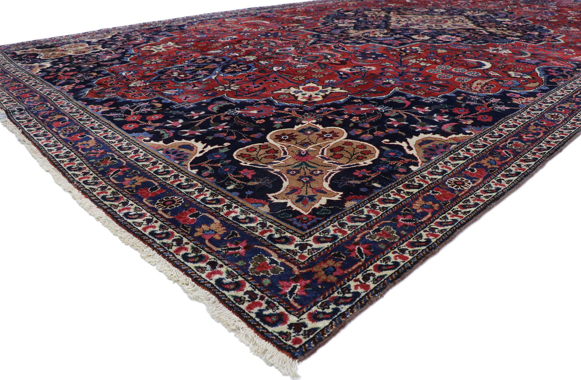 77748 Antique Persian Mashhad rug with Baroque Victorian Style 10'06 x 19'07. Ravishing and vibrant this hand knotted wool antique Persian Mashhad area rug features an elaborate cusped palmette medallion anchored with palmette pendants at either end