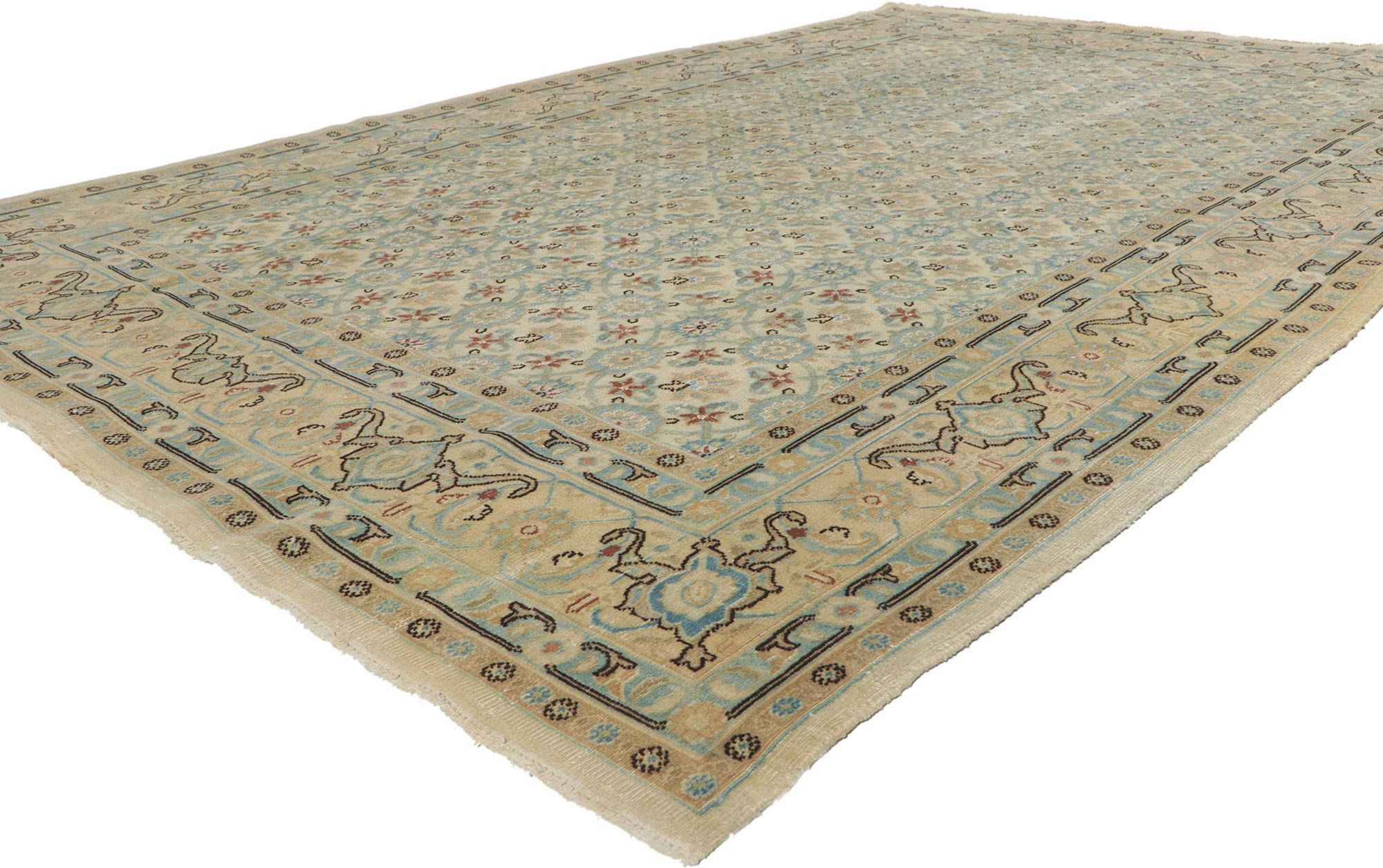 51543, antique Persian Mashhad rug. This hand-knotted wool antique Persian Mashhad rug features an all-over Herati pattern surrounded by a complementary Herati and rosette border in soft, light colors. Cleverly composed with contrasting outlines,