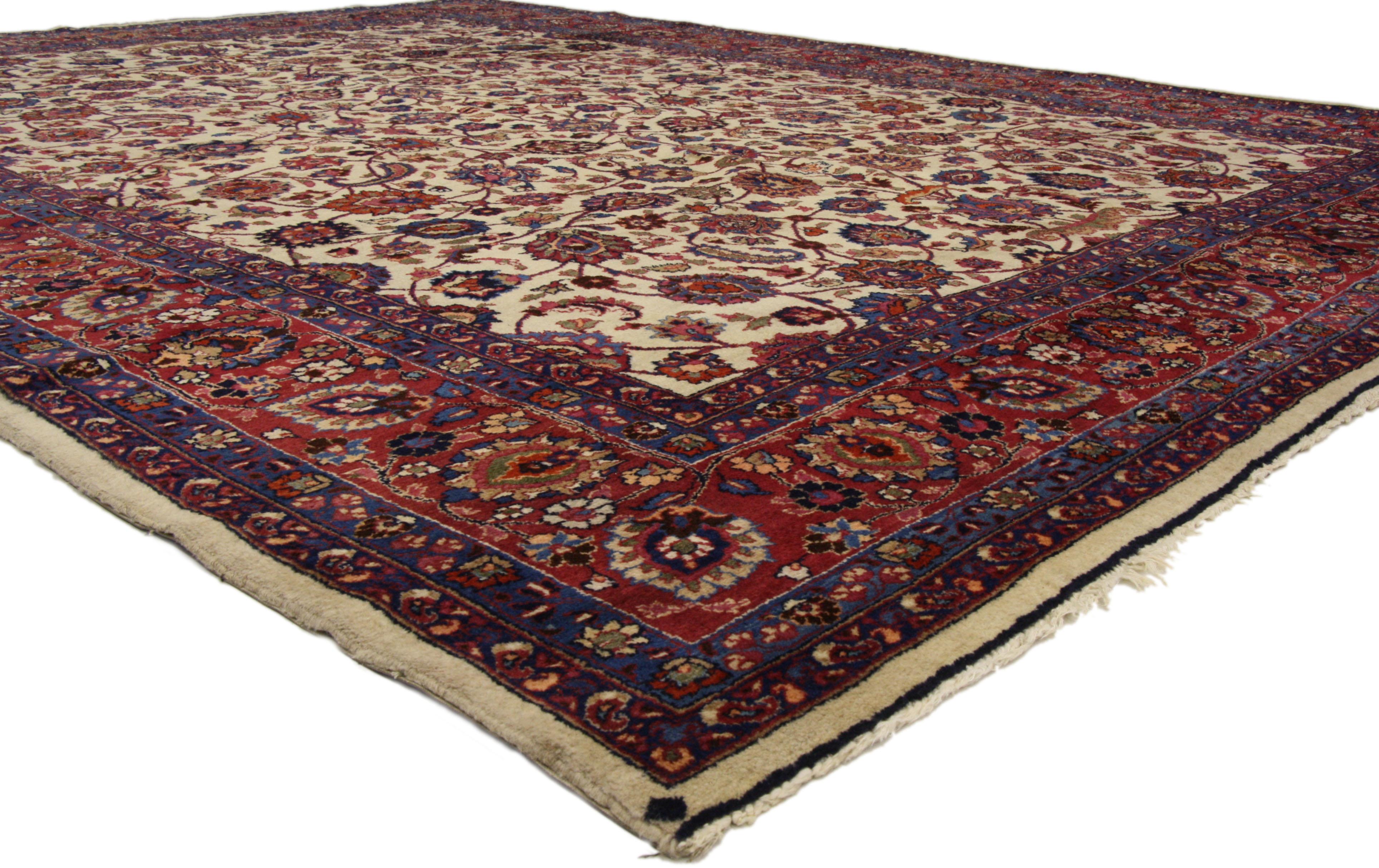 74041, antique Persian Mashhad rug with traditional style. This hand-knotted wool antique Persian Mashhad rug with traditional style features an allover pattern surrounded by a classic border creating a well-balanced and timeless design. This