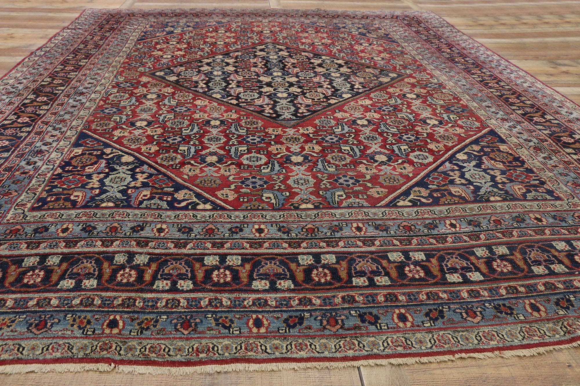 Wool Antique Persian Mashhad Rug with Traditional Style For Sale