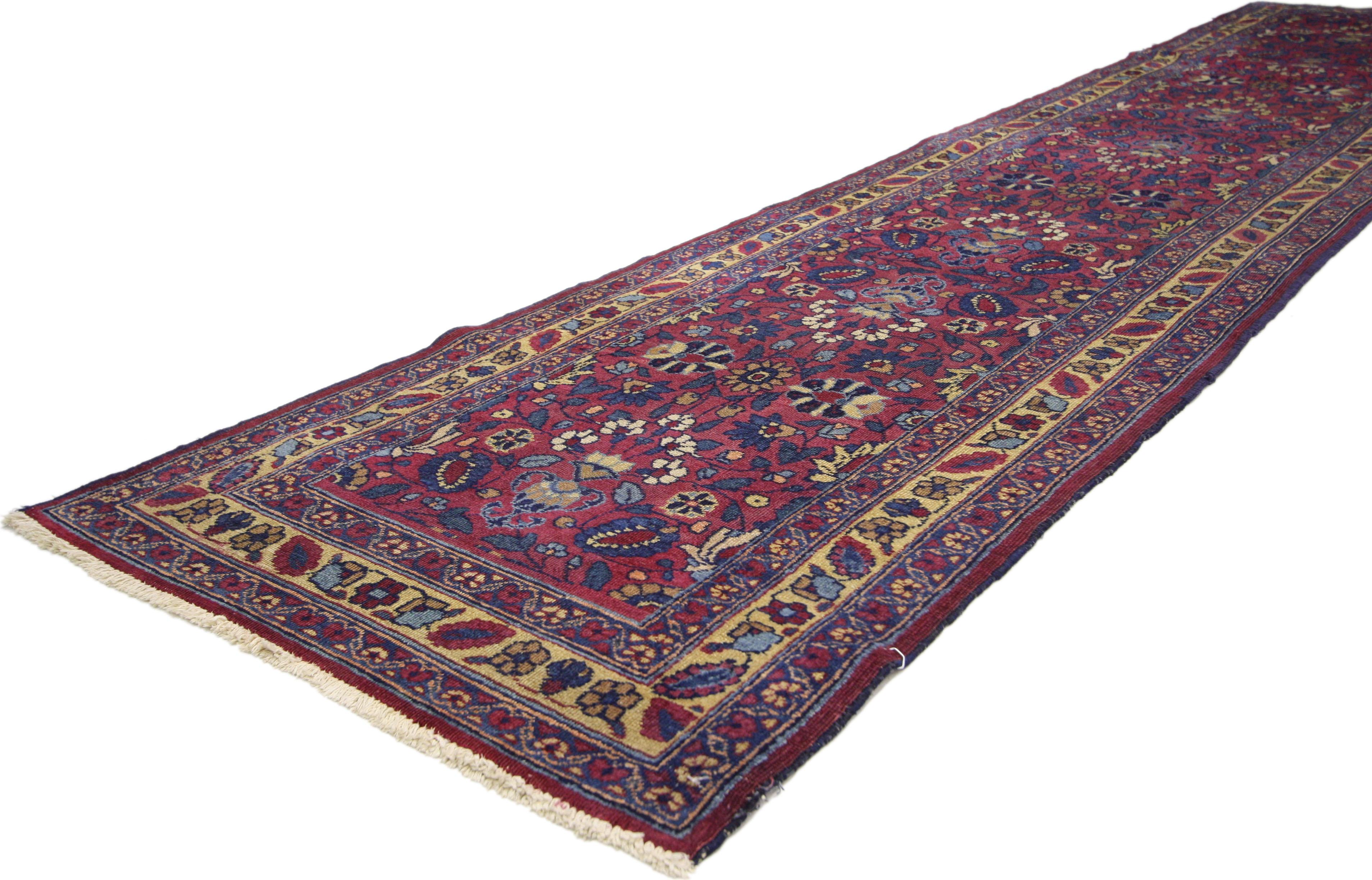 71710 antique Persian Mashhad runner, Traditional Hallway runner. Like a cornucopia of blossoms, the all-over pattern of this antique Persian Mashhad runner is a bountiful display of repeating multicolor florals filling abstract vase-like vessels.
