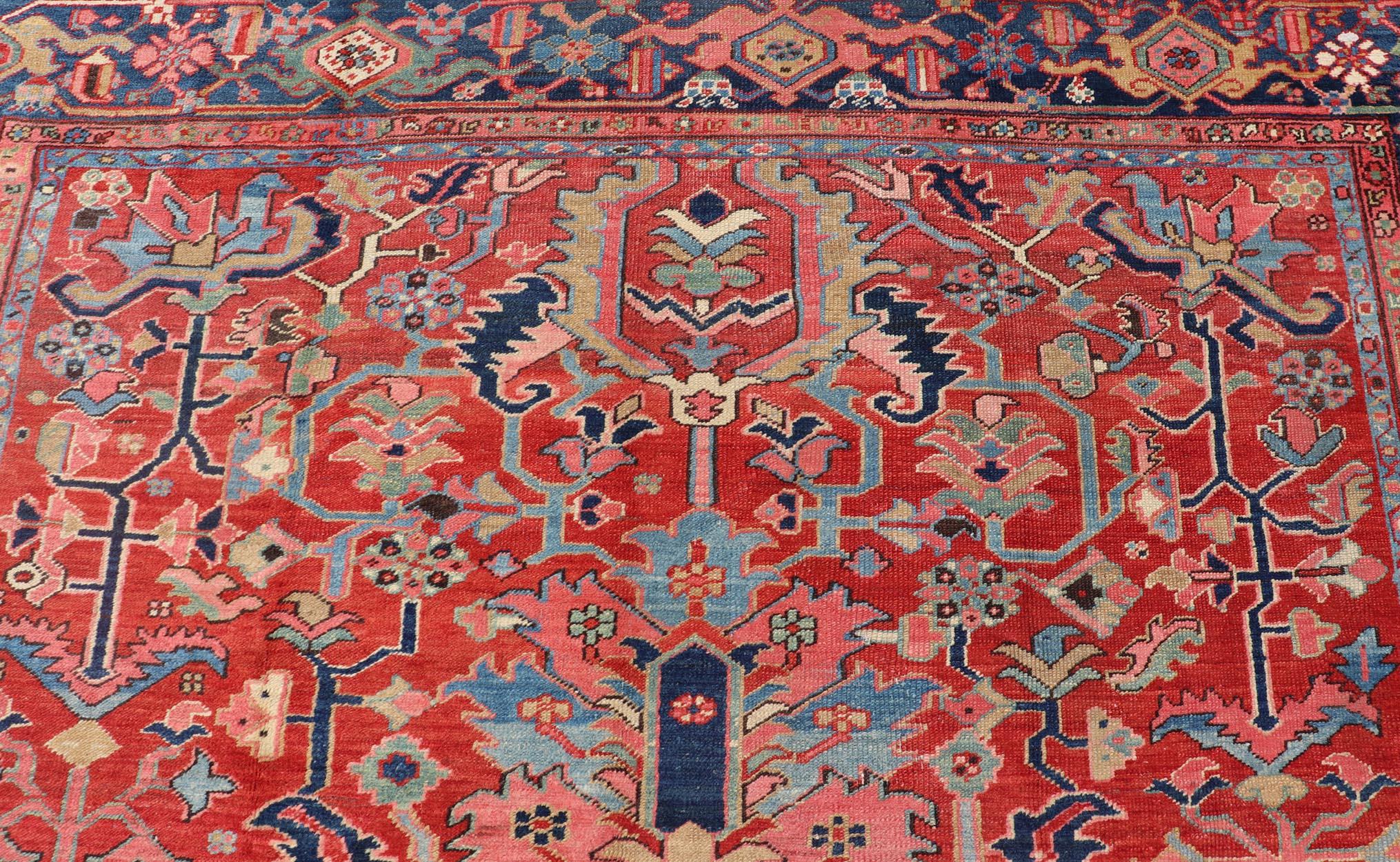 Wool Antique Persian Medallion Serapi Rug With Red Background and Blue Border For Sale