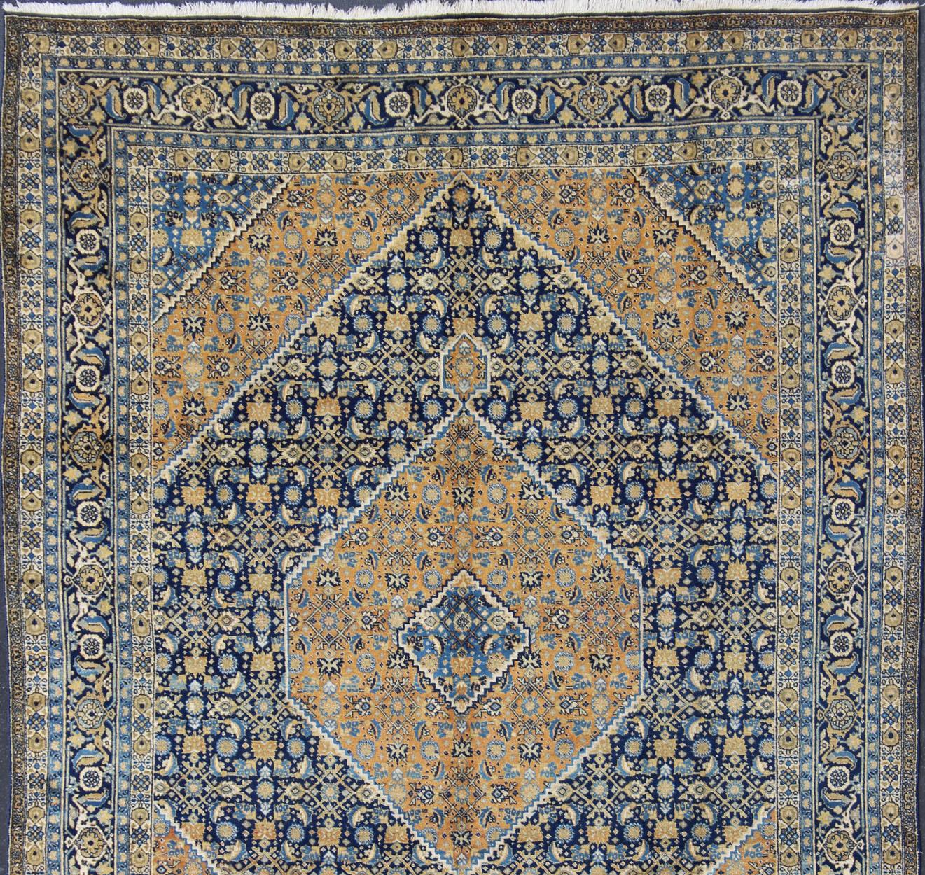 Antique Persian Tabriz Rug with Medallion And A Variety of Blue's and Gold's. Keivan Woven Arts / Rug / 16-1205, country of origin / type: Iran / Tabriz, circa 1920. Classic geometric Tabriz.
Measures: 9'3 x 12'5.
This antique Persian Tabriz rug