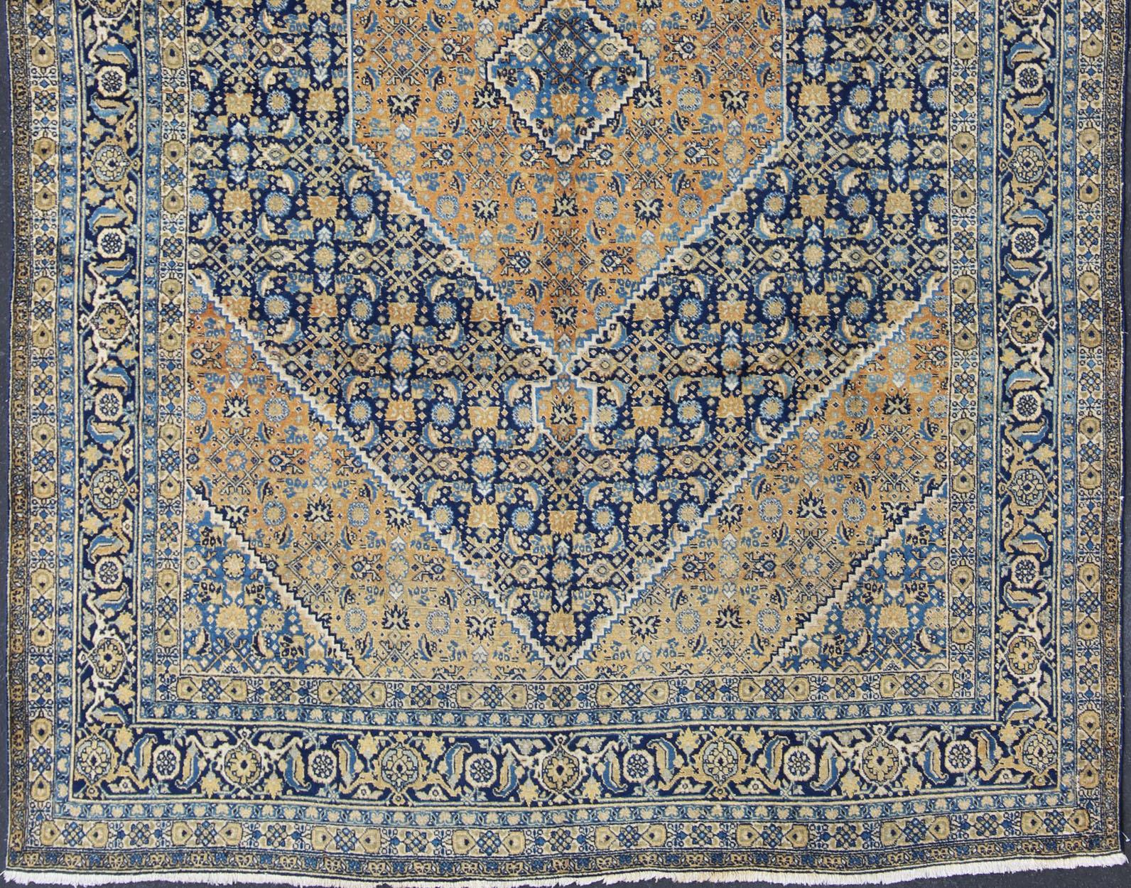 Antique Persian Tabriz Rug with Medallion And A Variety of Blue's and Gold's In Good Condition For Sale In Atlanta, GA