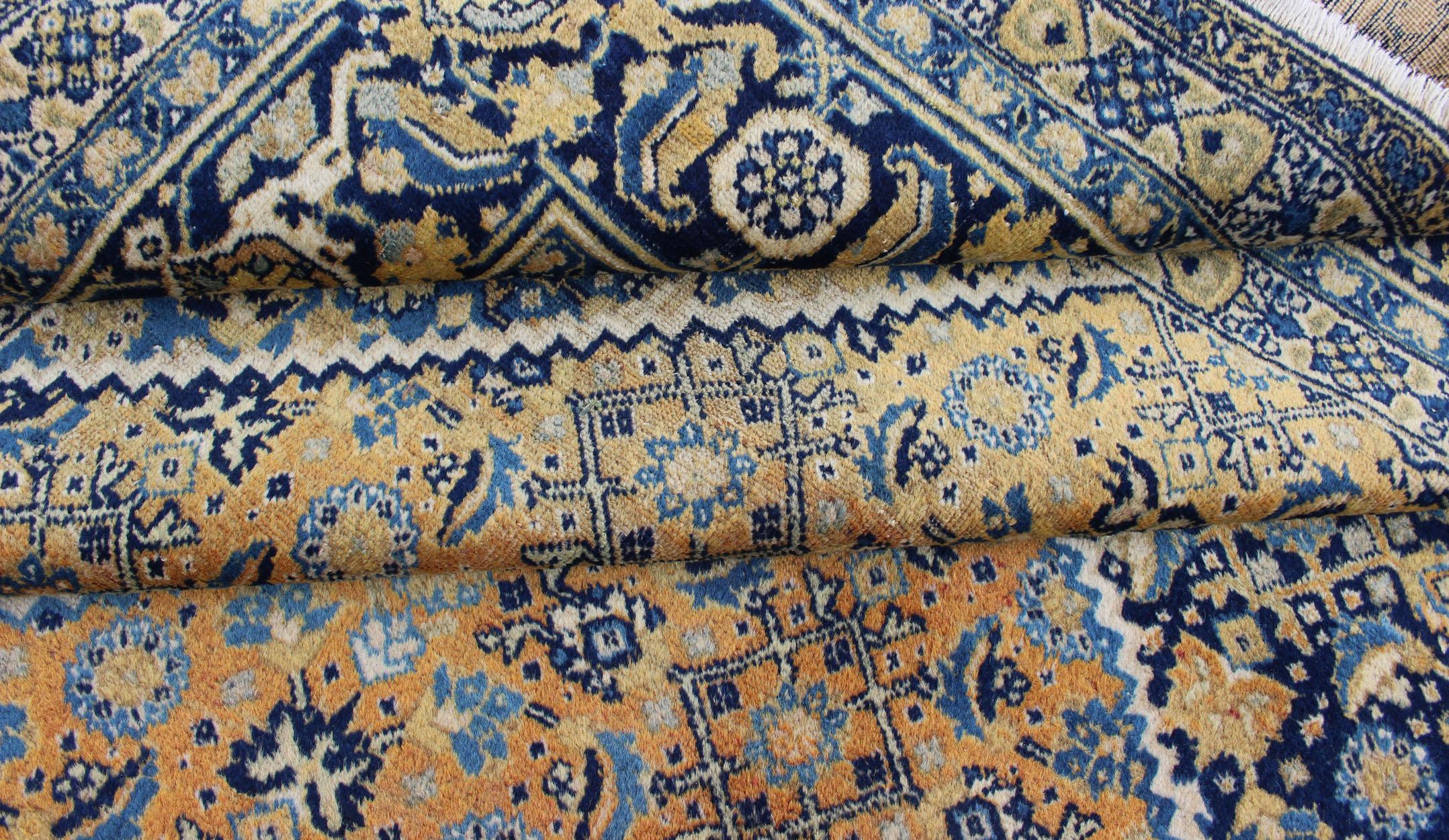 Wool Antique Persian Tabriz Rug with Medallion And A Variety of Blue's and Gold's For Sale