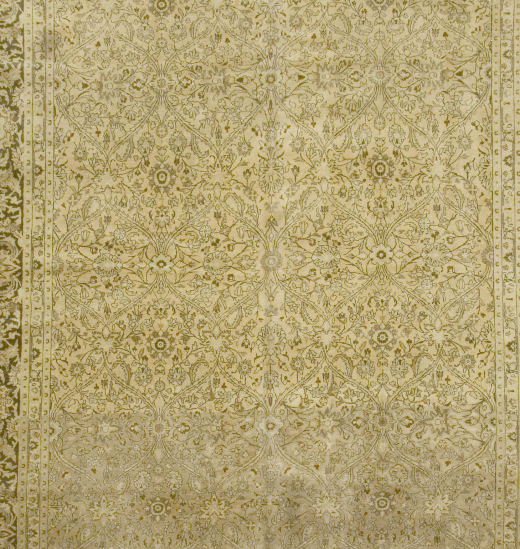 Antique Persian Meshad Rug, circa 1900, 9'7 x 13'2. Elegant curvilinear and floral patterns spread across the gold central field on this antique Meshad rug from Persia. A dark auburn border with creme botanical patterns surrounds the rug and