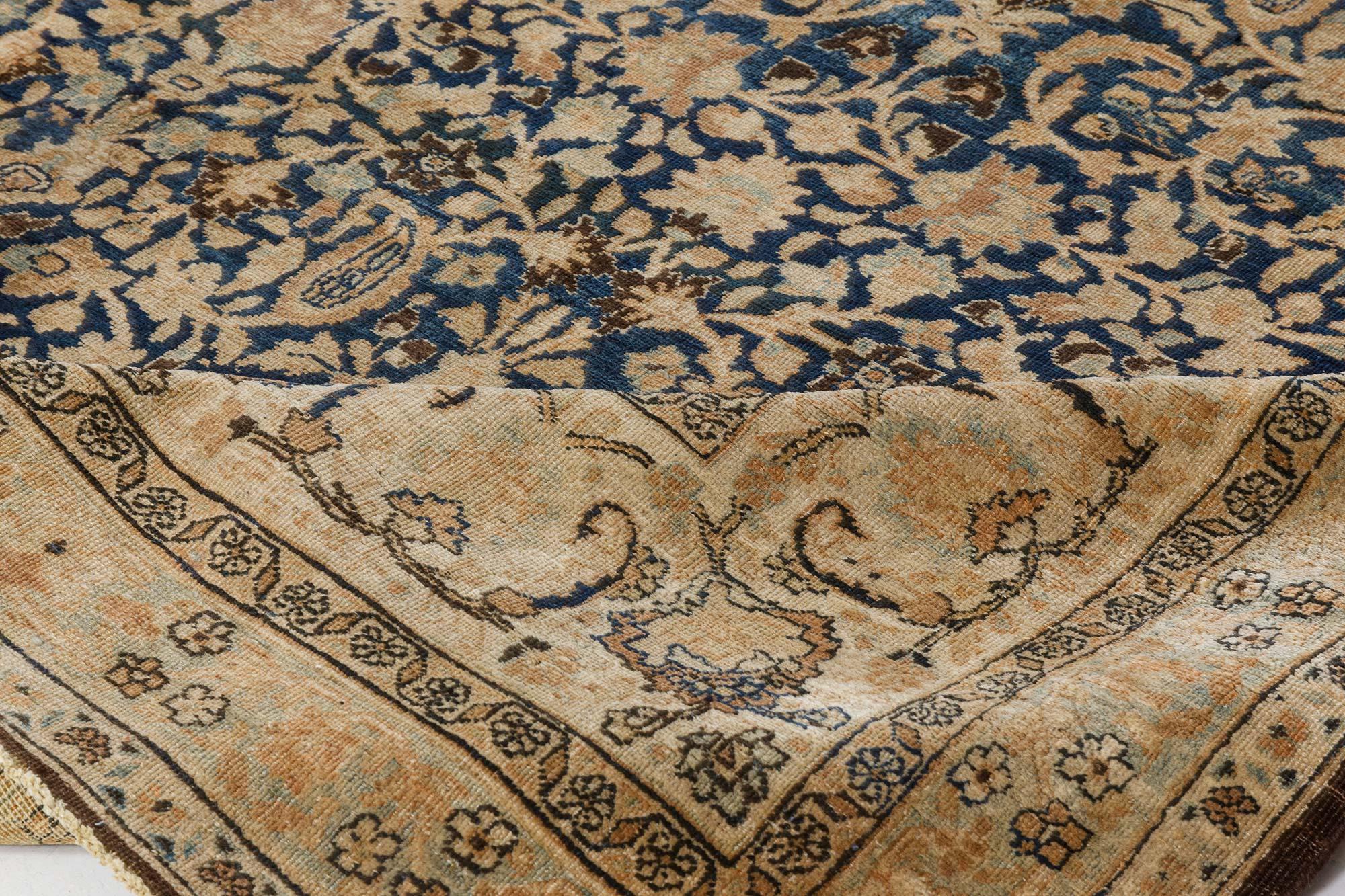 Antique Persian Meshad rug in beige, blue and brown
Size: 9'1