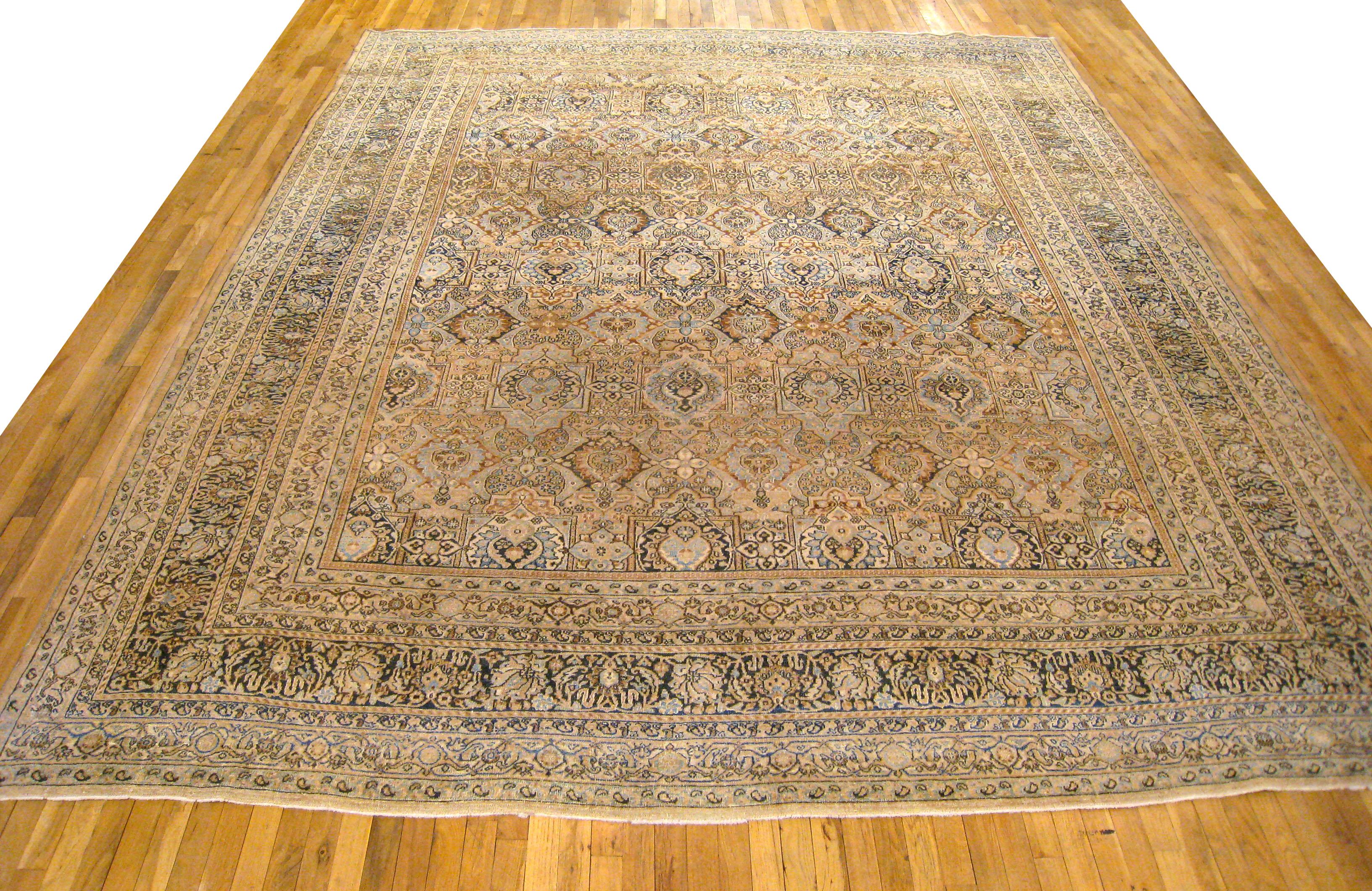 Antique Persian Meshed Oriental rug, Large size

An antique Persian Meshed oriental rug, size 13'4 x 10'7, circa 1910. This handsome hand-woven geometric rug features floral elements allover the brown field. The central field is enclosed within an