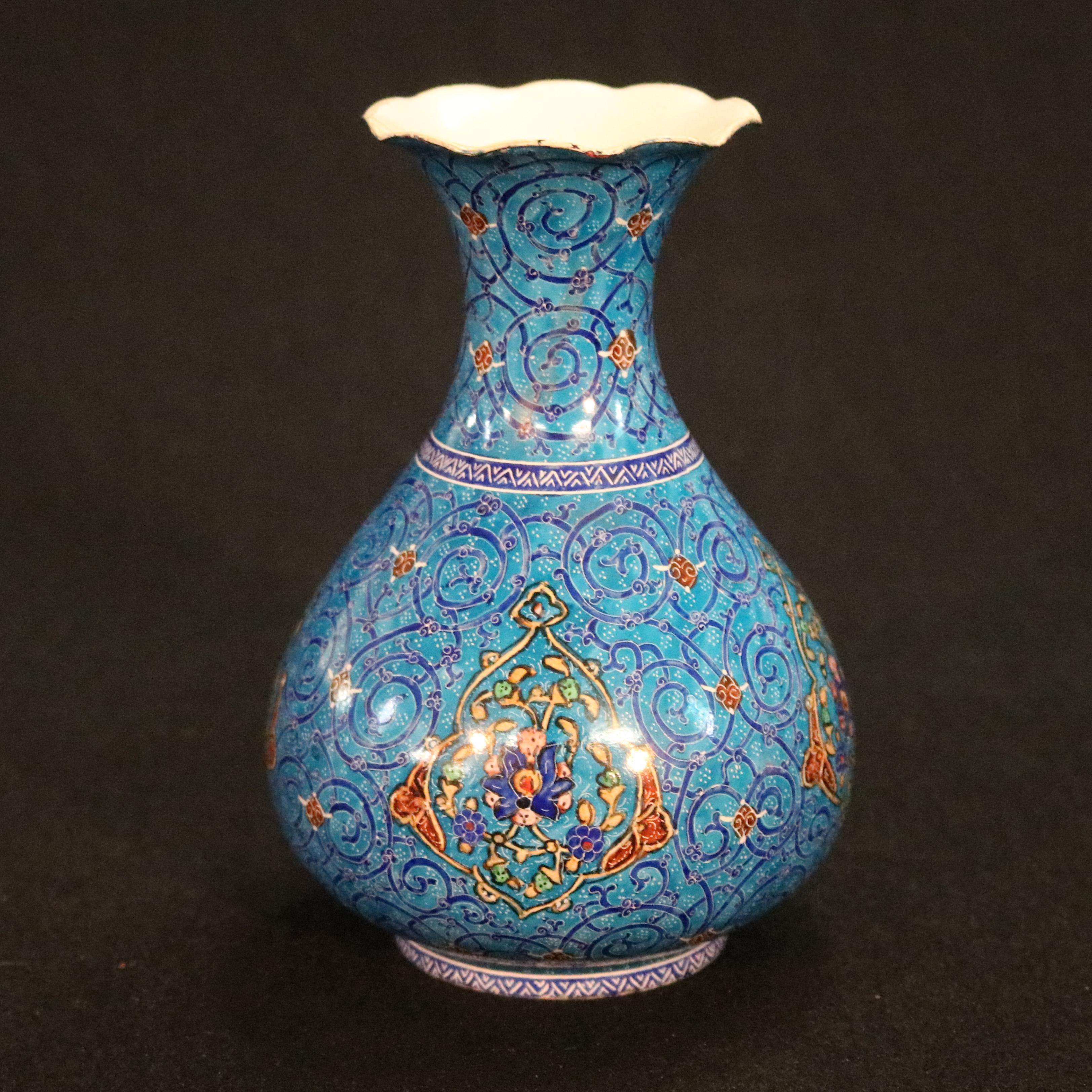 An antique Moorish vase offers metal construction with bulbous base and ruffled rim, hand enameled with all-over intricate scroll and foliate design, reserve with Persian elements, Artist-signed on base in Farci as photographed, circa