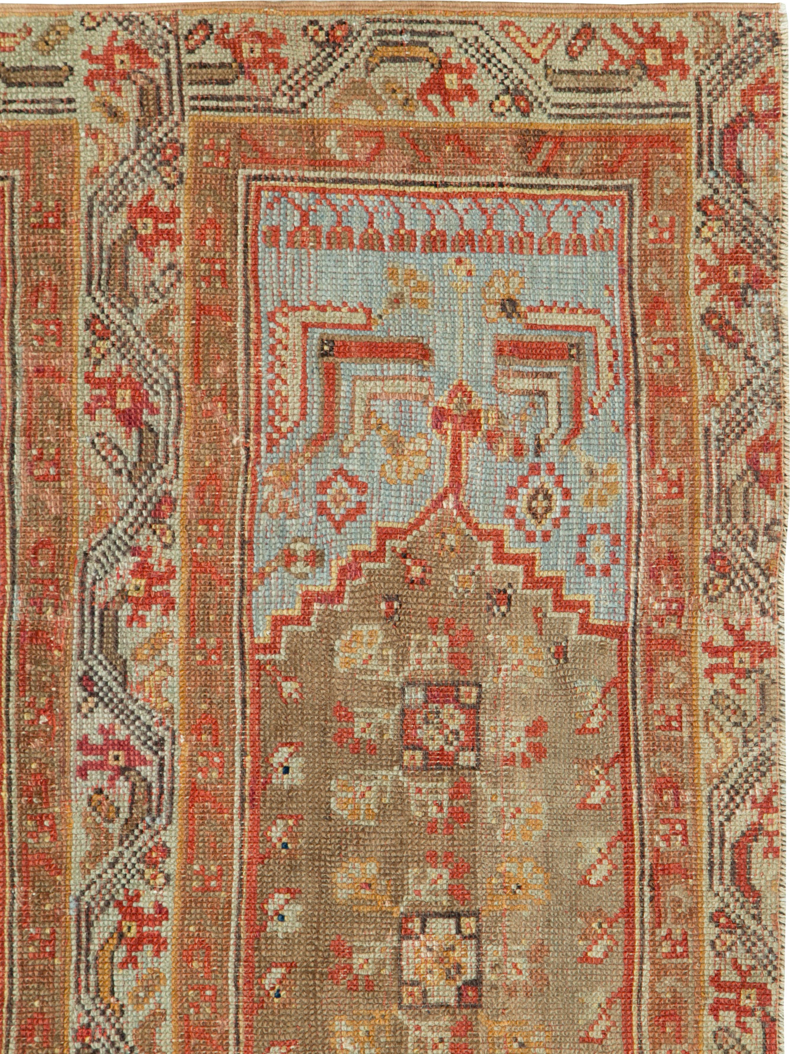 An antique Turkish Ghiordes carpet from the late 19th century.