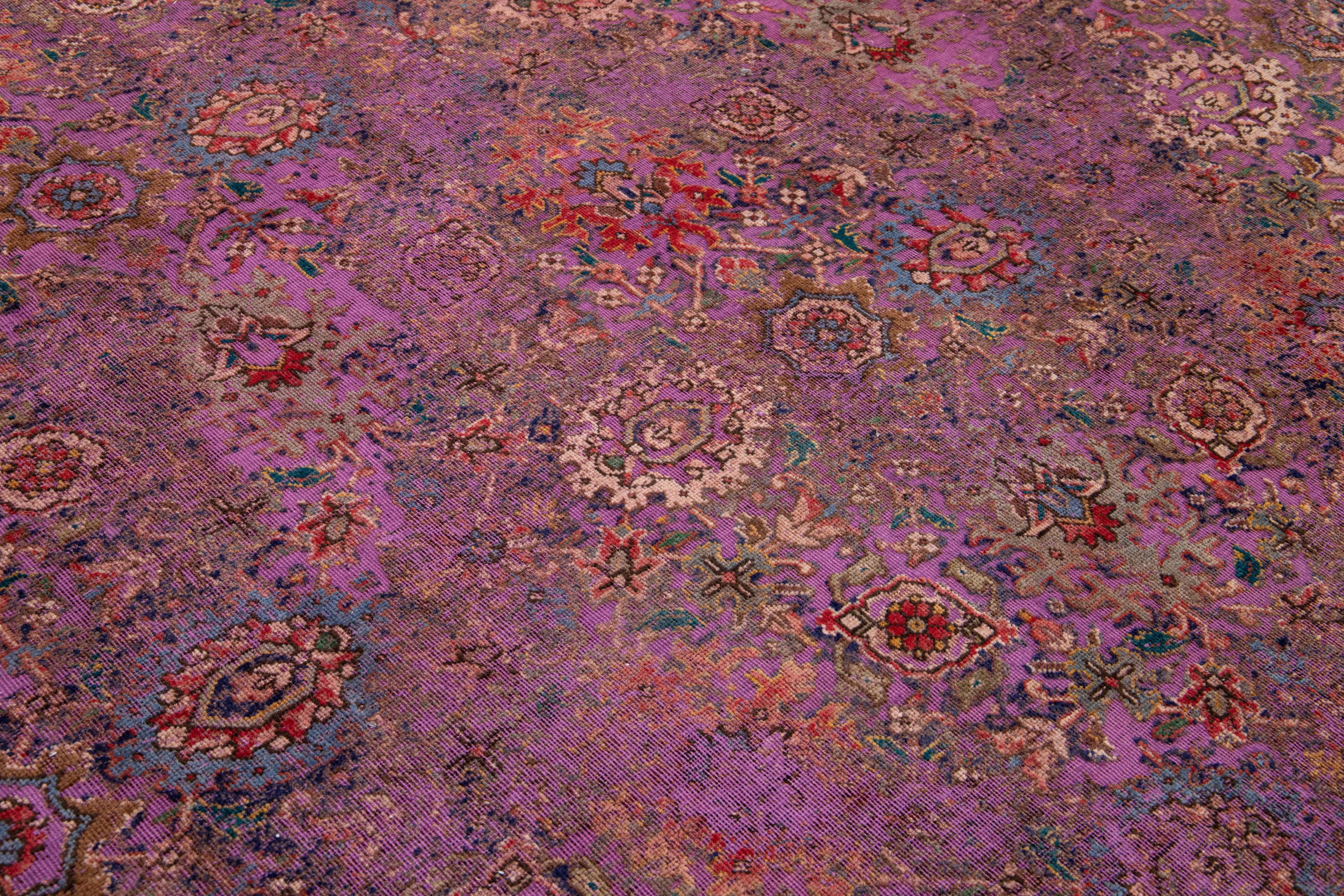 20th Century Antique Persian Overdyed Wool Rug With Floral Pattern In Purple For Sale