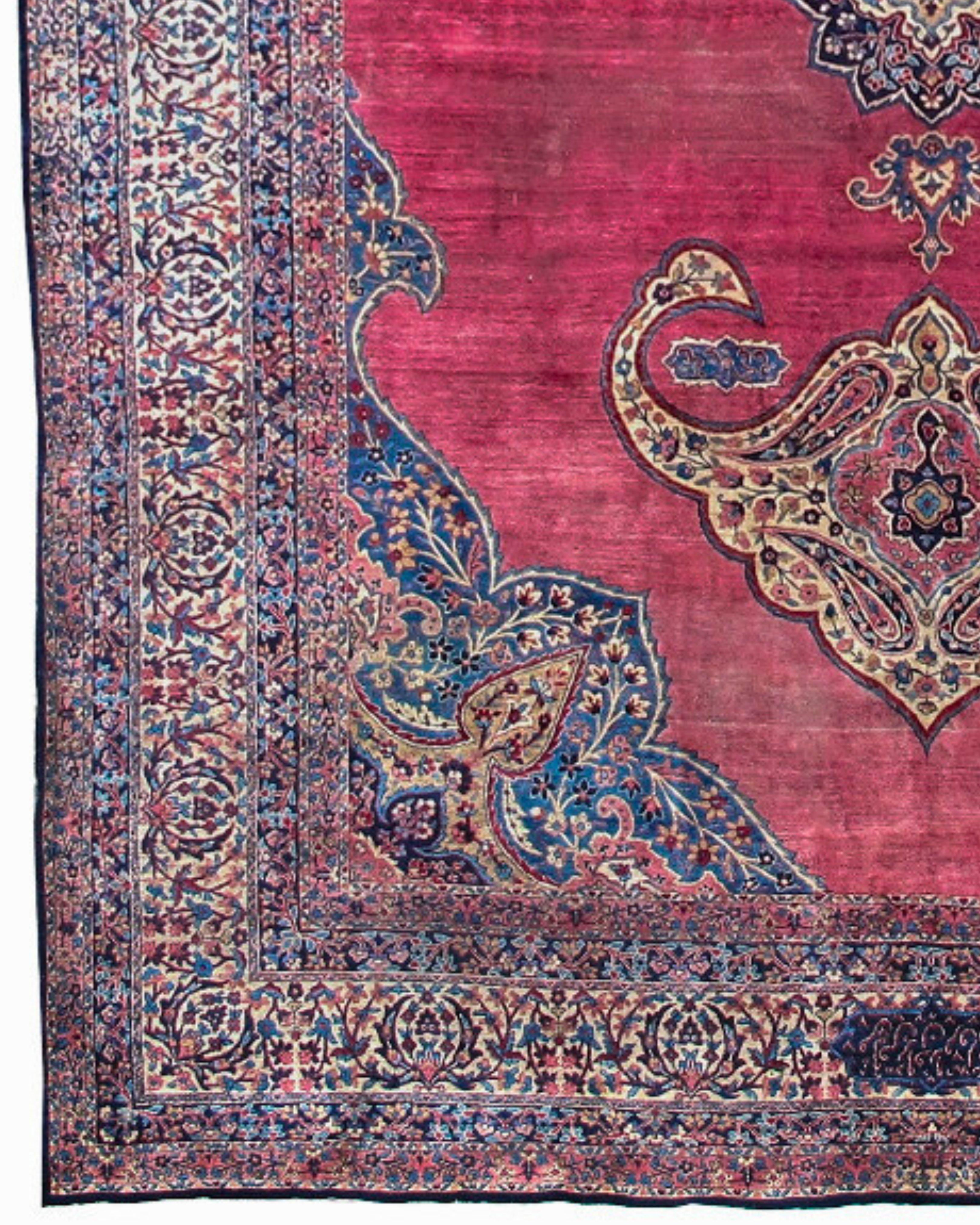 Antique Large Persian Oversized Kirman Rug, Early 20th Century

This fine oversized Kerman corridor carpet from southeastern Persia melds the classicism of early Persian medallion carpets of the Safavid age (1501-1722) with the elegance and grace of