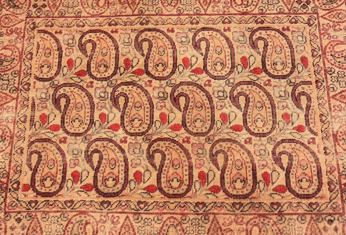 Antique Persian Paisley Kerman rug, country of origin: Persia, date: circa final quarter of the 19th century. Size: 1 ft 9 in x 1 ft 4 in (0.53 m x 0.41 m). 

