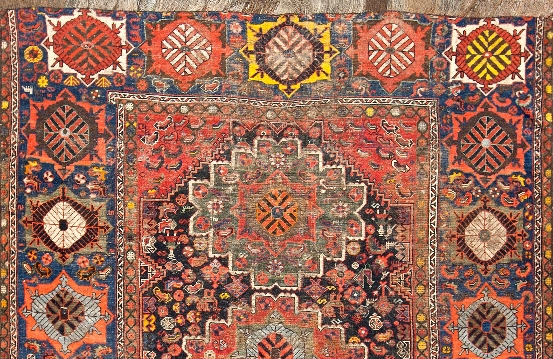 The wonderful design in this Qashqai, with the three bold floral heads sitting in the central field. All surrounded by similar but smaller designs in the border. The use of the strong yellows adds a unique feel to the piece. The Qashqai are a tribal