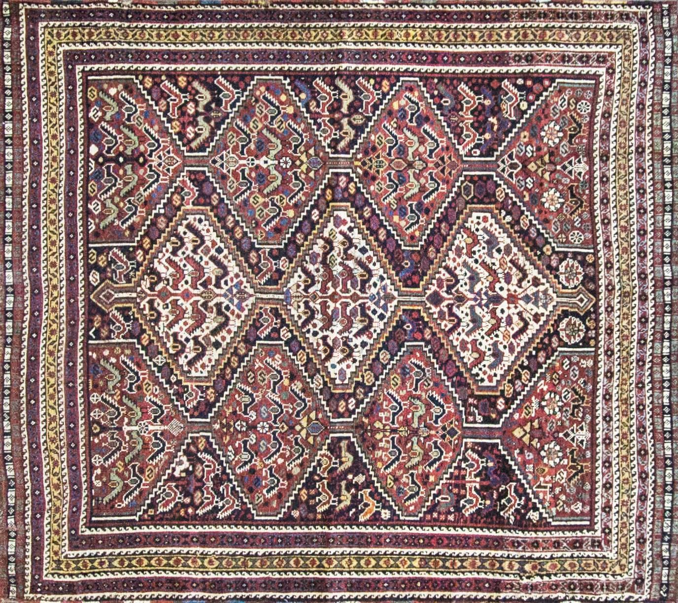Antique Persian Qashgai tribal birds rug, wool pile over wool foundation, natural colors and dyes.
The Qashgai nomads are found in the Fars province in the southwest of Iran. They move twice a year, between the winter pasture near the Persian Gulf