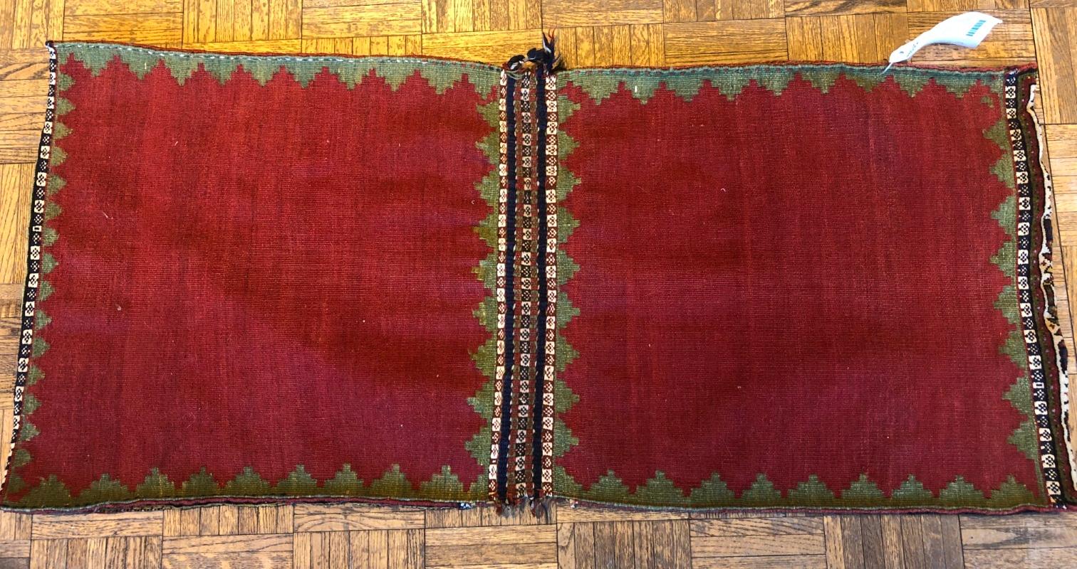 Southwest Persian tribal saddlebag hand knotted wool. Made for use on horses or camels. This is a complete double saddlebag with front and back, both face and back are intact.