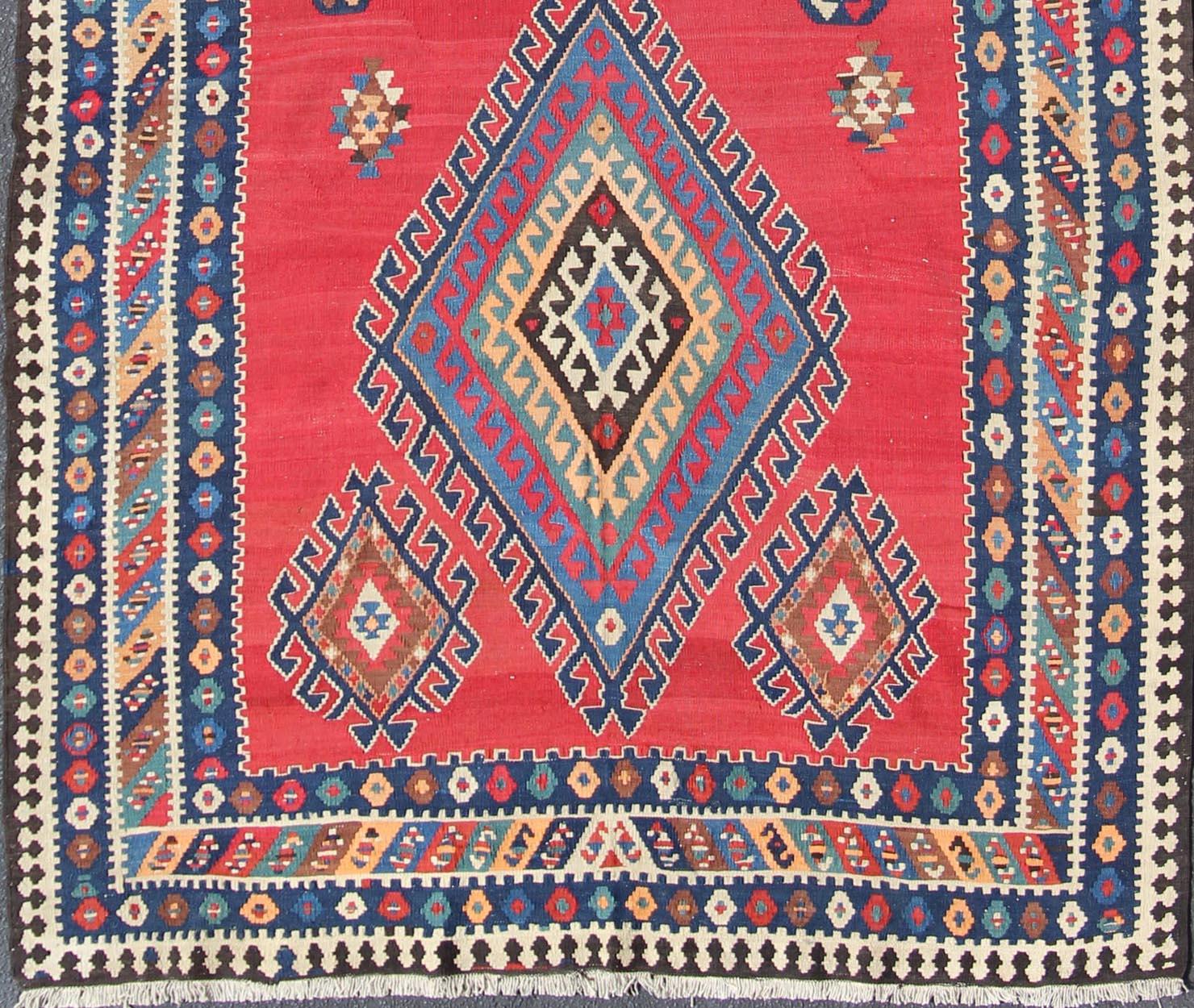 Vibrant color-toned Geometric Design Kilim Runner antique Qashqai Kilim Gallery from Persia, rug 19-0402, country of origin / type: Iran / Kilim, circa 1920

Featuring a geometric diamond medallion design, with complementary geometric motifs