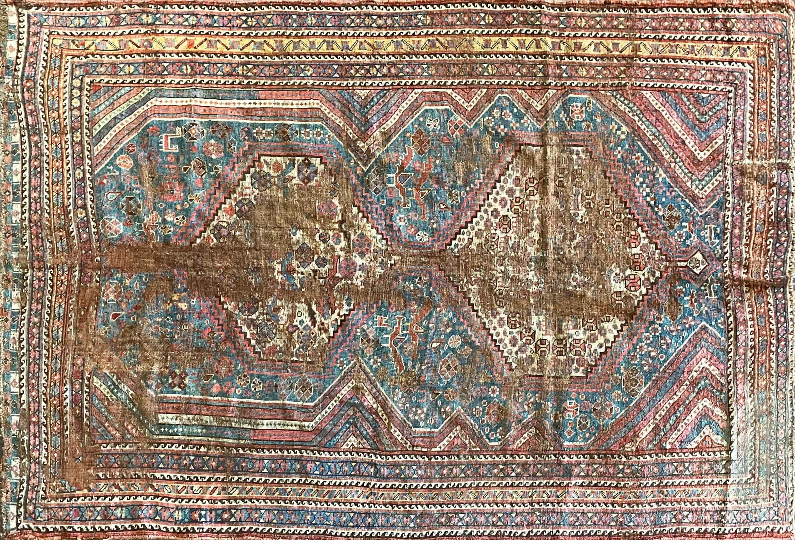Exquisite Antique Persian Qashqai Rug - A True Masterpiece

Transport yourself to the rich heritage of Persian craftsmanship with this remarkable Antique Qashqai Rug, dating back to the 1870s and measuring 4'5
