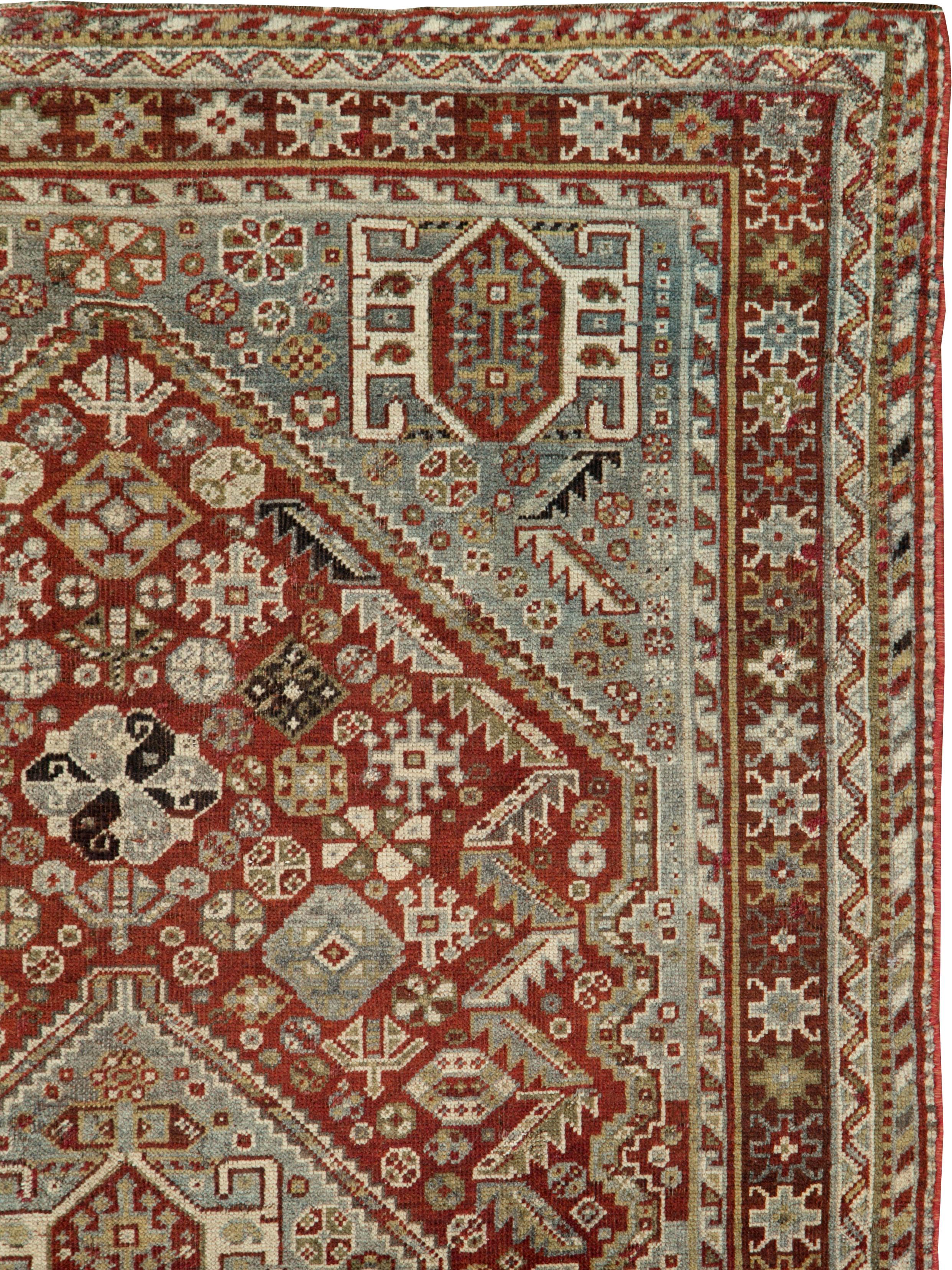 An antique Persian Qashqai rug from the early 20th century.

Measures: 4' 1