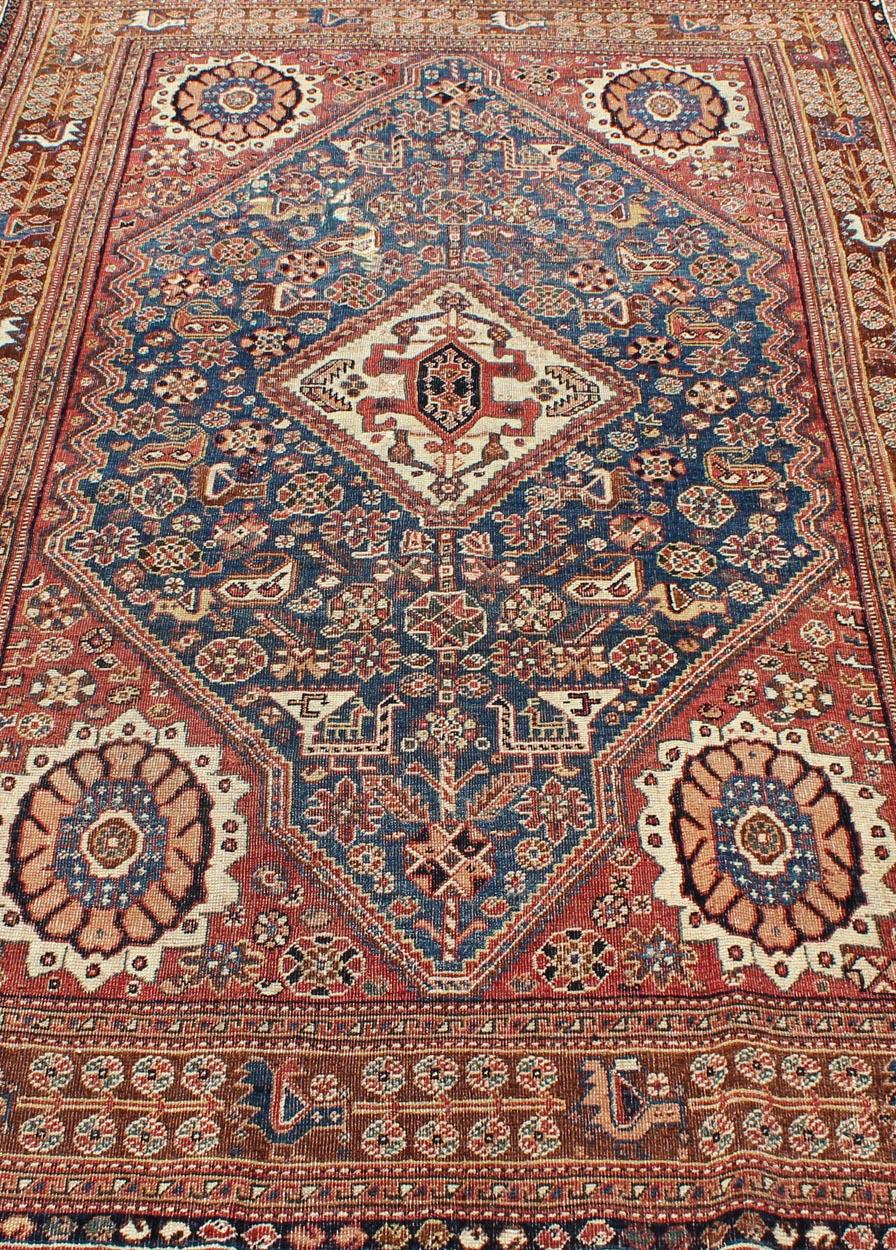 20th Century Antique Persian Qashqai Rug with Central Medallion in Ink Blue and Faded Red For Sale