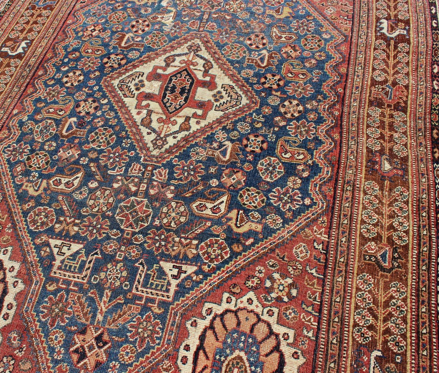 Antique Persian Qashqai Rug with Central Medallion in Ink Blue and Faded Red In Good Condition For Sale In Atlanta, GA