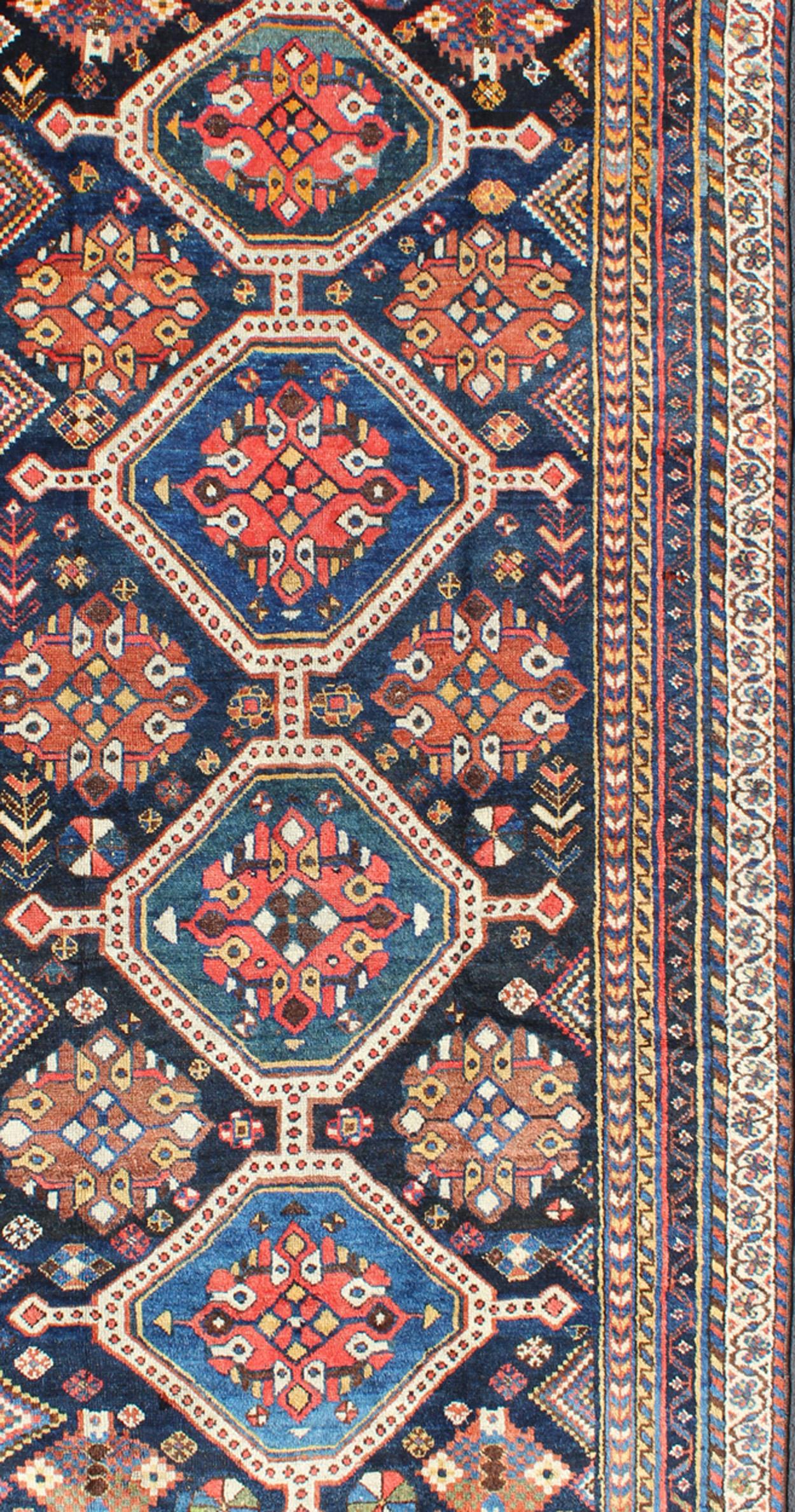 Hand-Knotted Antique Persian Qashqai Rug with Four-Medallion Design in Blue, Red, Brown Tones For Sale