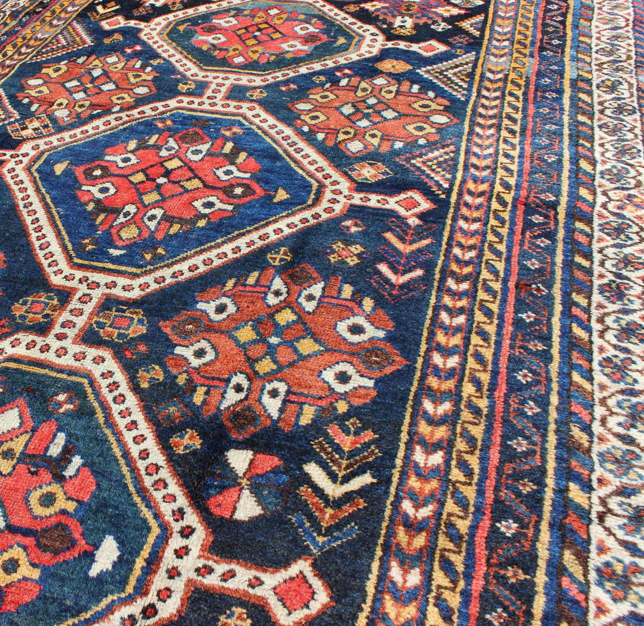 Antique Persian Qashqai Rug with Four-Medallion Design in Blue, Red, Brown Tones For Sale 1
