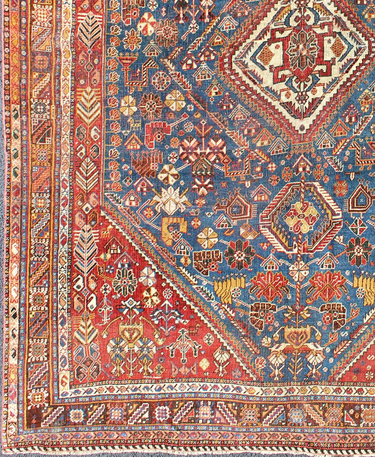 Qashqai Persian antique carpet in vibrant color tones with diamond medallion, rug ema-7558, country of origin / type: Iran / Qashqai, circa 1910.

The Qashqai nomads are found in the Fars province in southwest Iran. They move twice a year, between