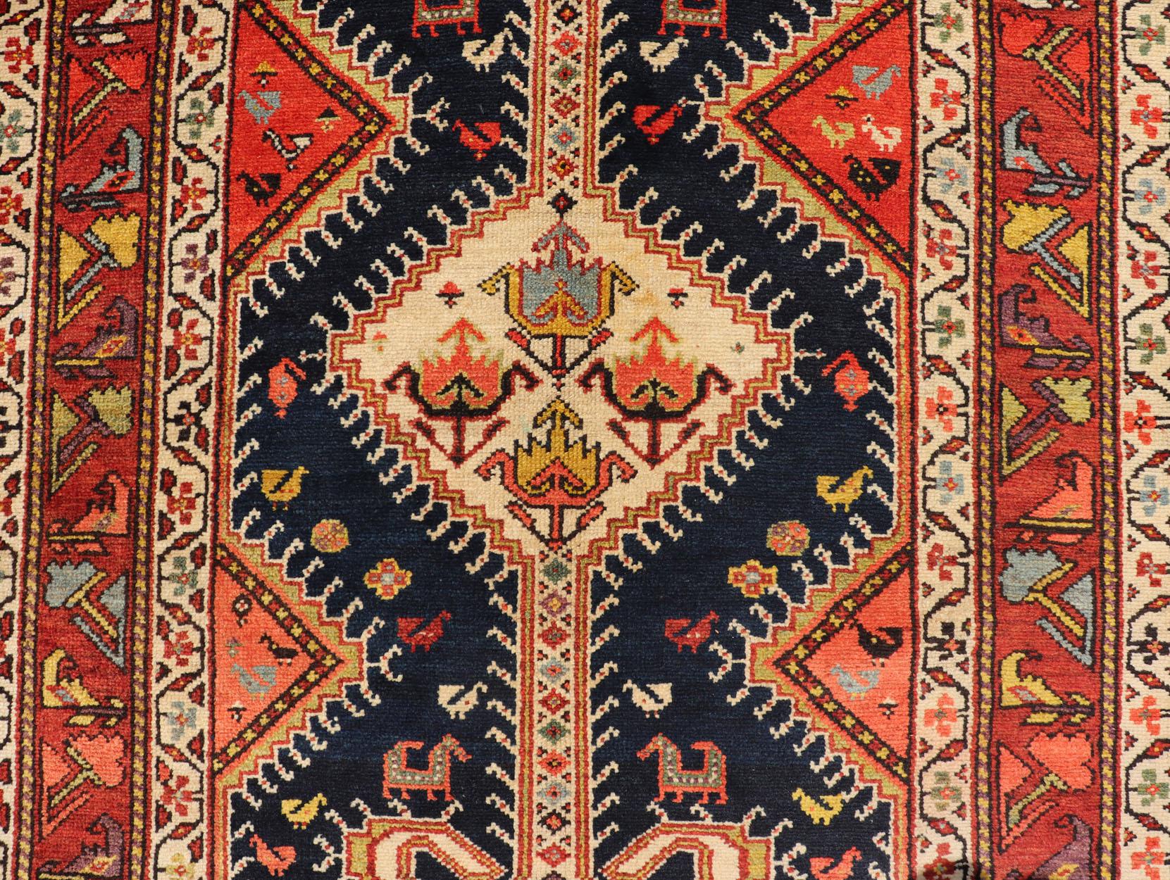 Tribal Antique Persian Qashqai Runner with Geometric Medallion Design in Vivid Colors  For Sale