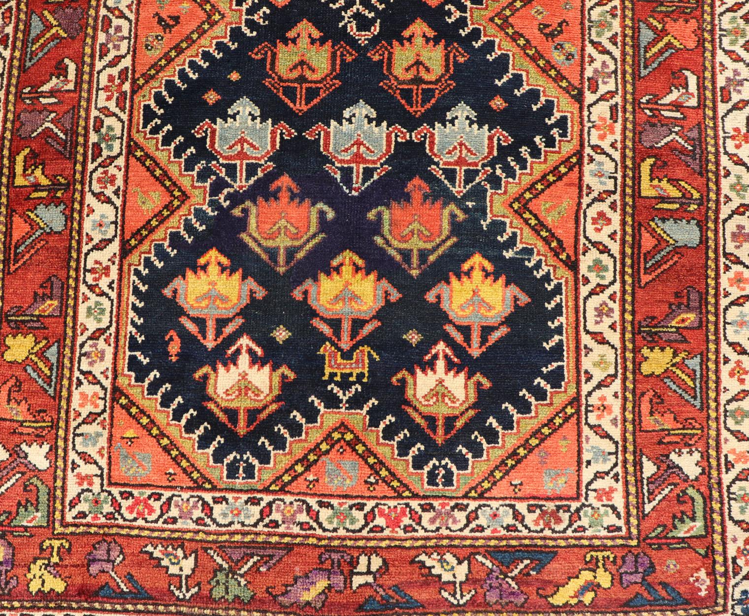 Hand-Knotted Antique Persian Qashqai Runner with Geometric Medallion Design in Vivid Colors  For Sale