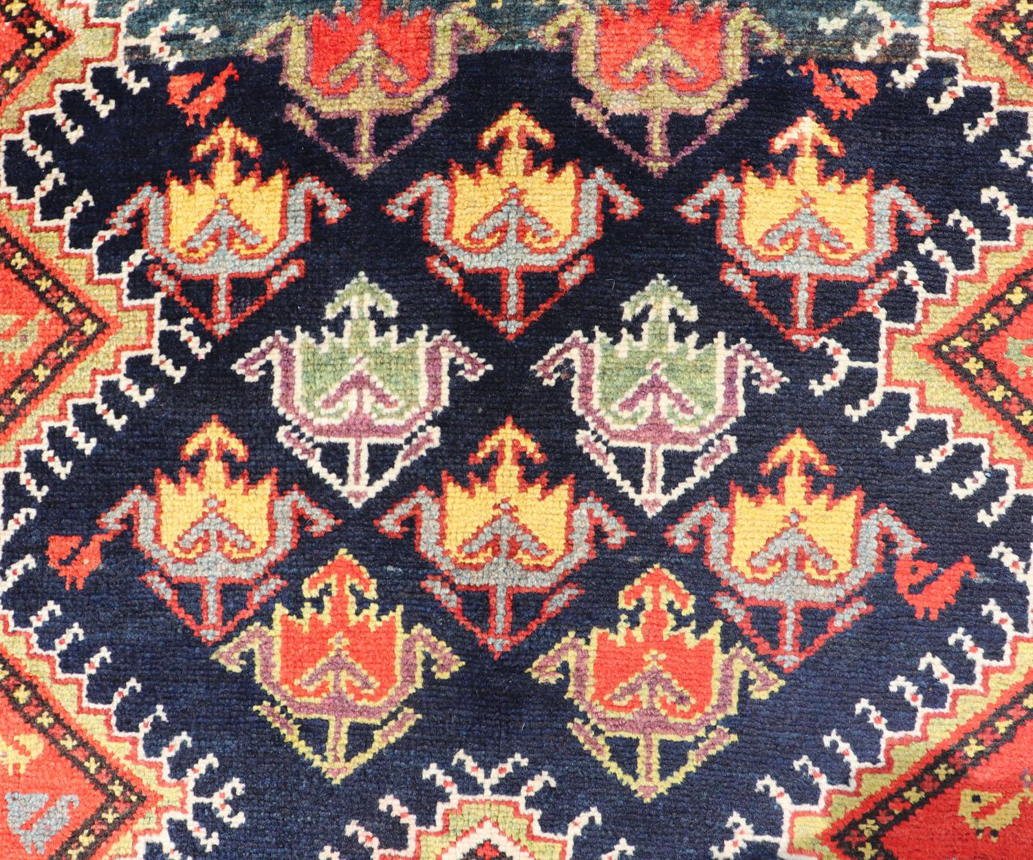Wool Antique Persian Qashqai Runner with Geometric Medallion Design in Vivid Colors  For Sale
