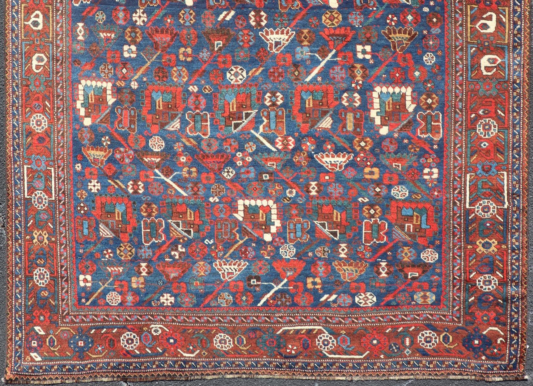 Wool Antique Persian Qashqai Shiraz Tribal Rug with All-Over Tribal Design For Sale