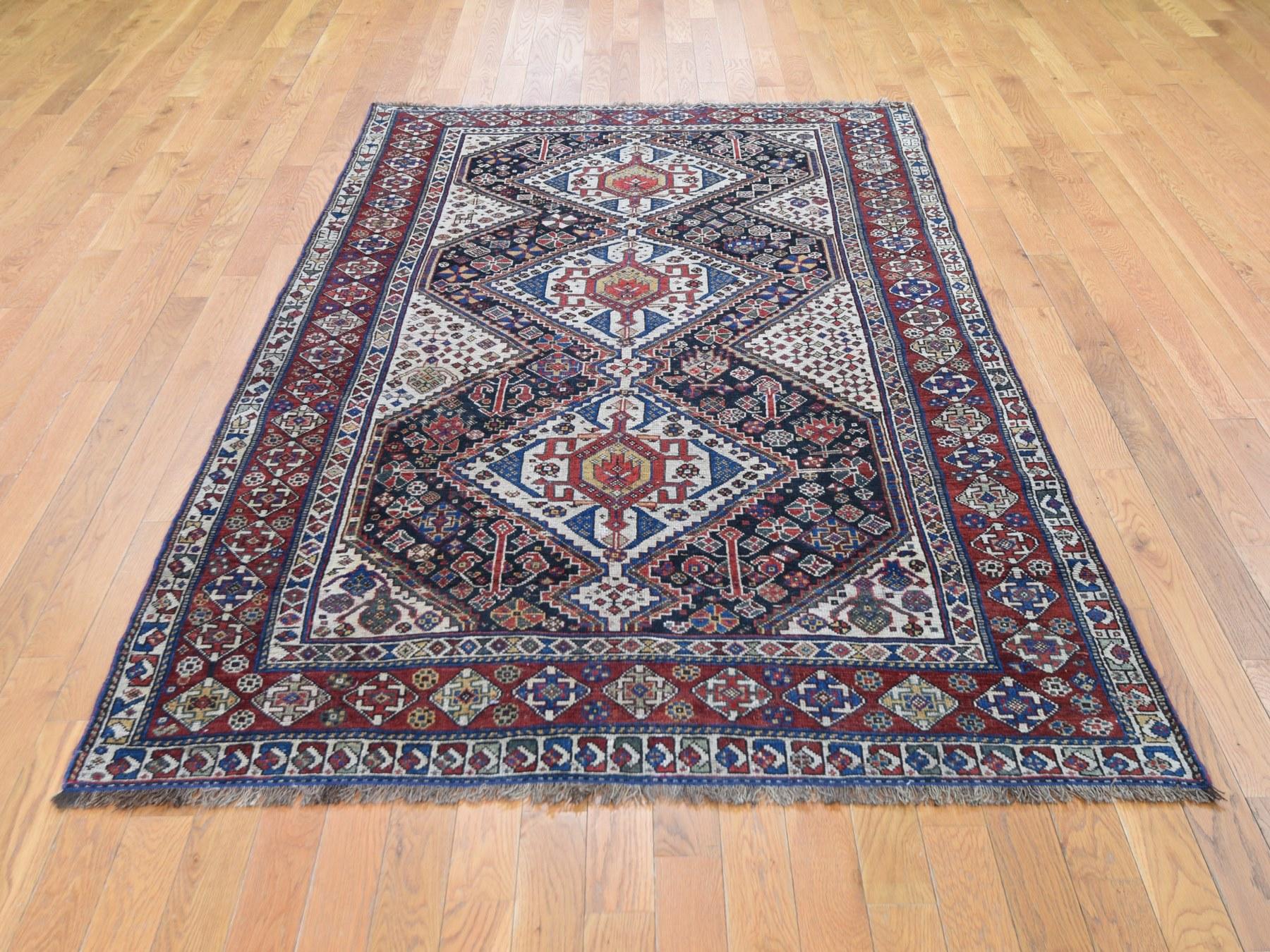 This is a truly genuine one of a kind antique Persian Qasqui tribal geometric even wear hand knotted rug. It has been knotted for months and months in the centuries-old Persian weaving craftsmanship techniques by expert artisans.

Origin of weaving