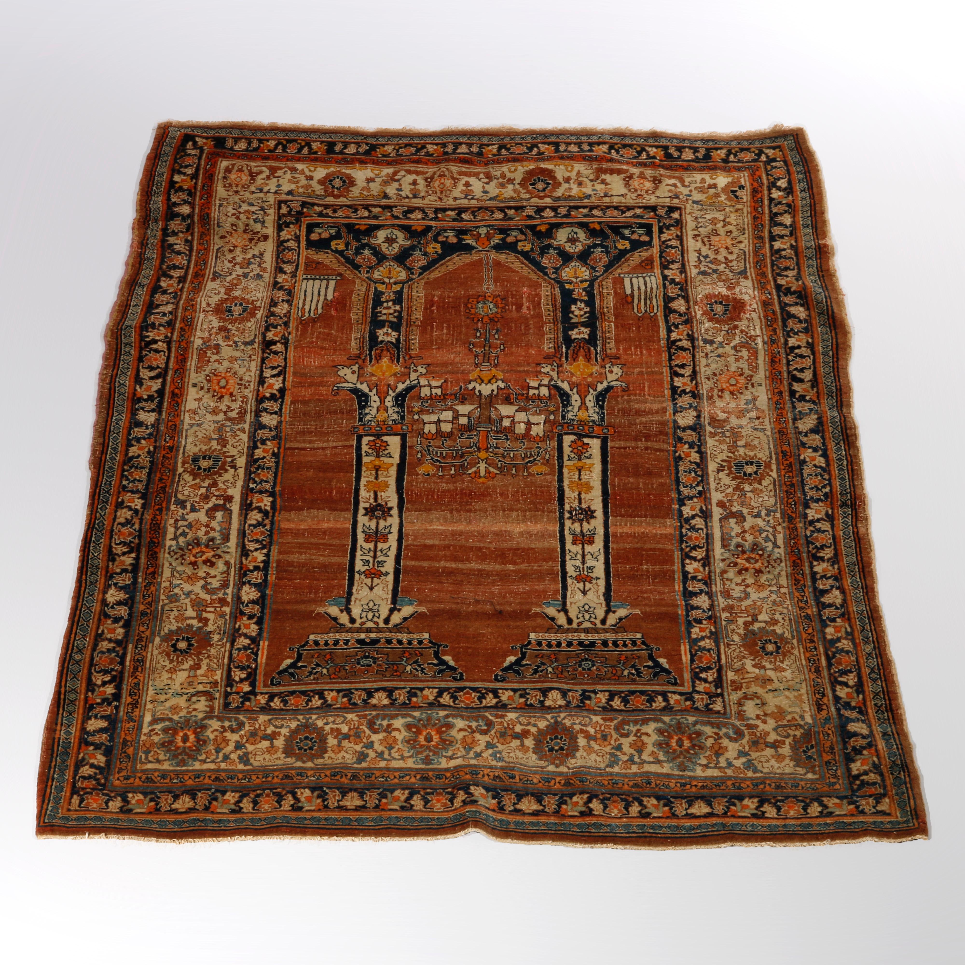 An antique Persian Qum oriental prayer rug offers wool construction with temple, design having stylized floral and foliate elements throughout, 19th century

Measures- 76.5''L X 53.5''W X .5''D.