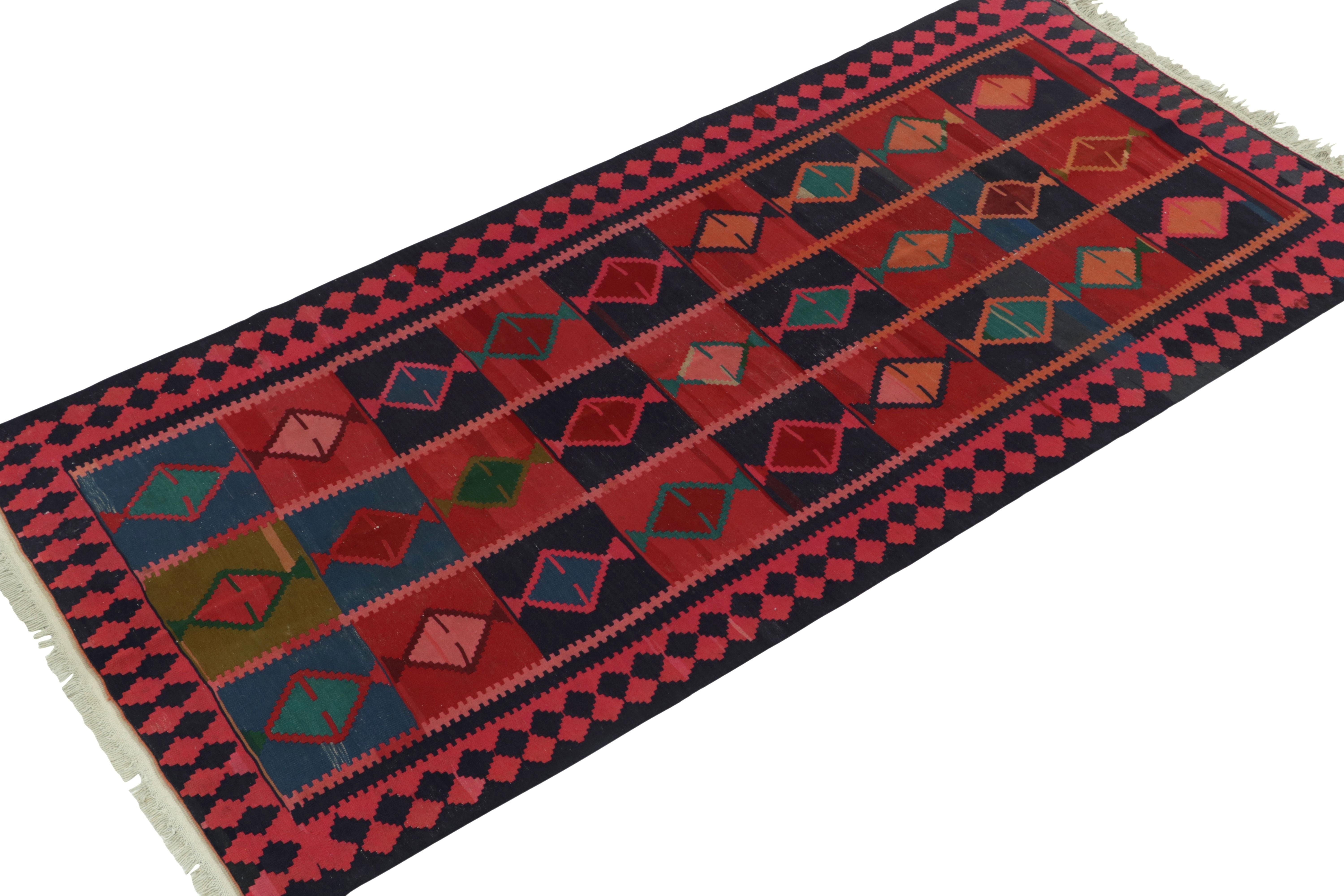 Hand-knotted in wool, an antique Persian Kilim rug originating circa 1920-1930, joining Rug & Kilim’s most coveted flat weaves. 

Celebrating fine aesthetics of a reputed tribal artisan, the 5x10 collectible features an emphasis of geometric motifs