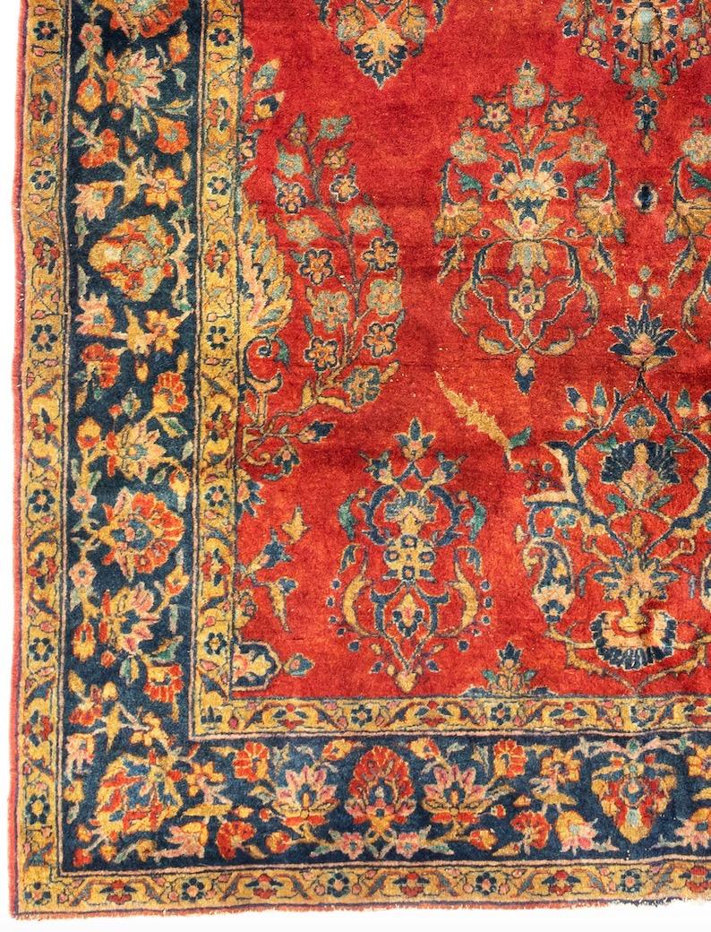 Antiker persischer Kashan-Wollteppich in Rotgold und Marineblau aus Manchester, ca. 1920er Jahre (Persisch) im Angebot