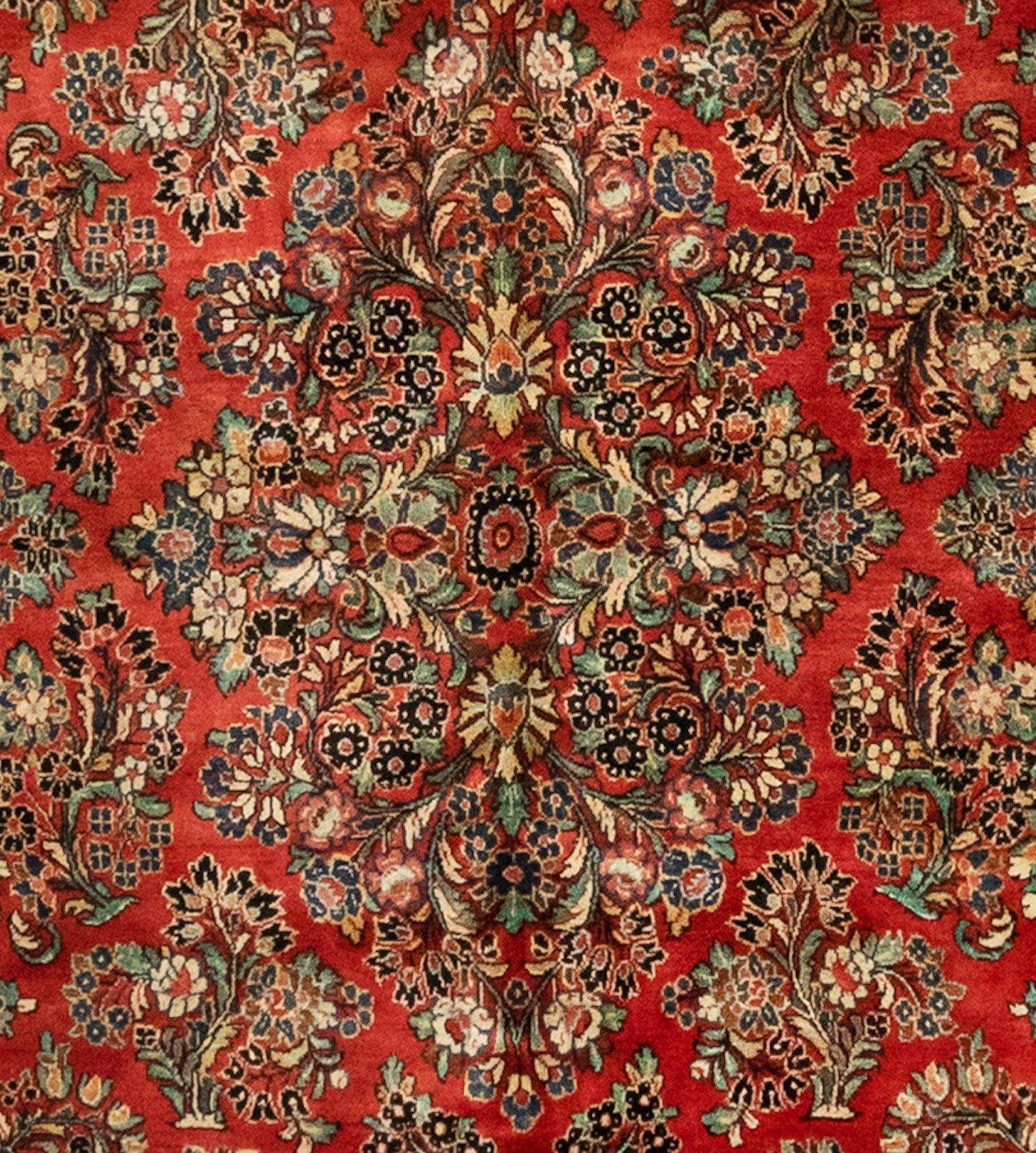 Sarouk is a small village and its neighboring villages in Northwestern Iran. Most Sarouk carpets follow a very distinctive design and is depended on floral sprays and bouquets. 

This is a fine example of an antique Sarouk carpet dating from the