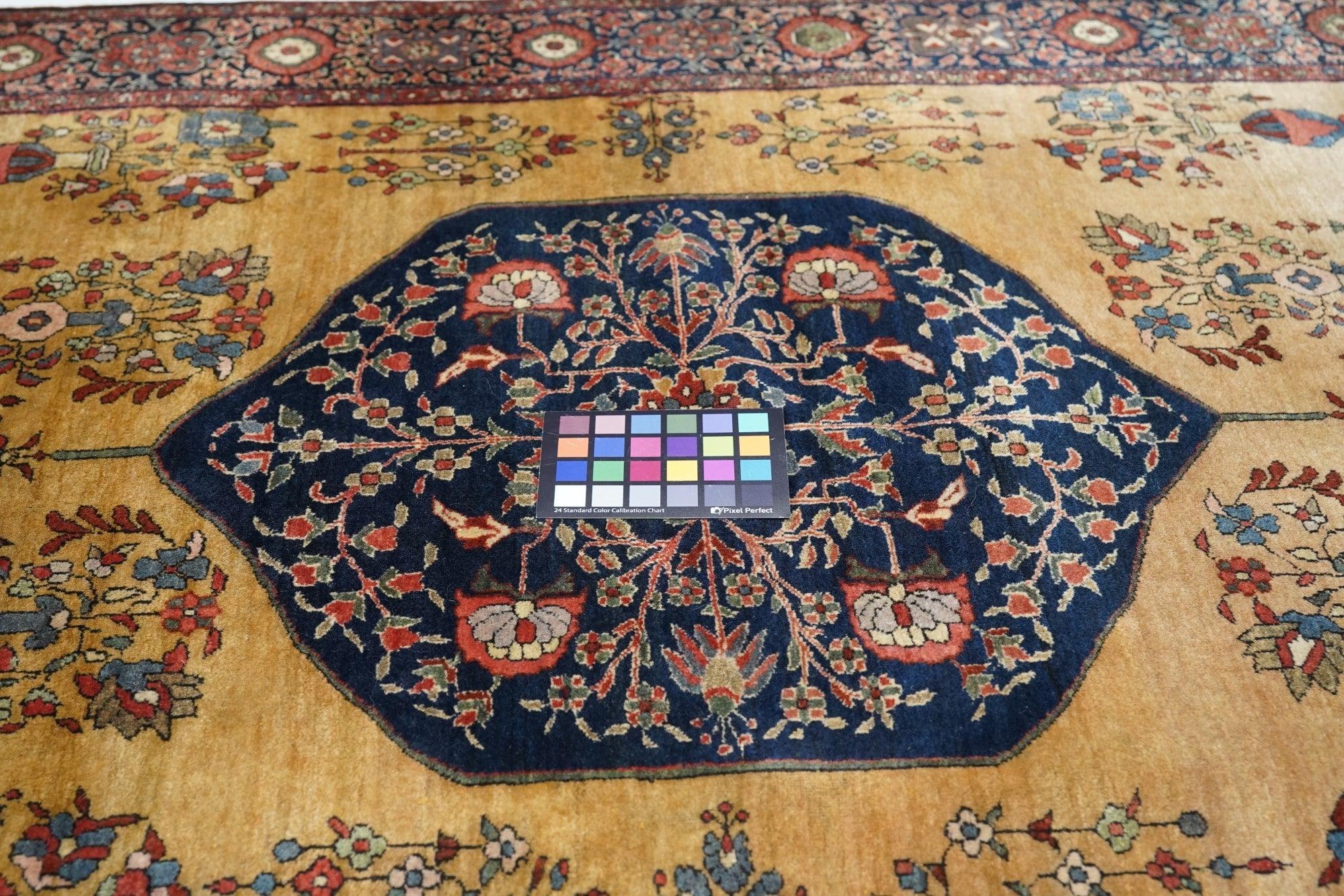 Antique Persian Rug 4'3'' x 6'9''. Attributed to Mohajeran village, the source of many of the best Sarouks, this straw field scatter mixes the detached floral spry field pattern with the earlier Farahan Sarouk border of rosettes and lobed