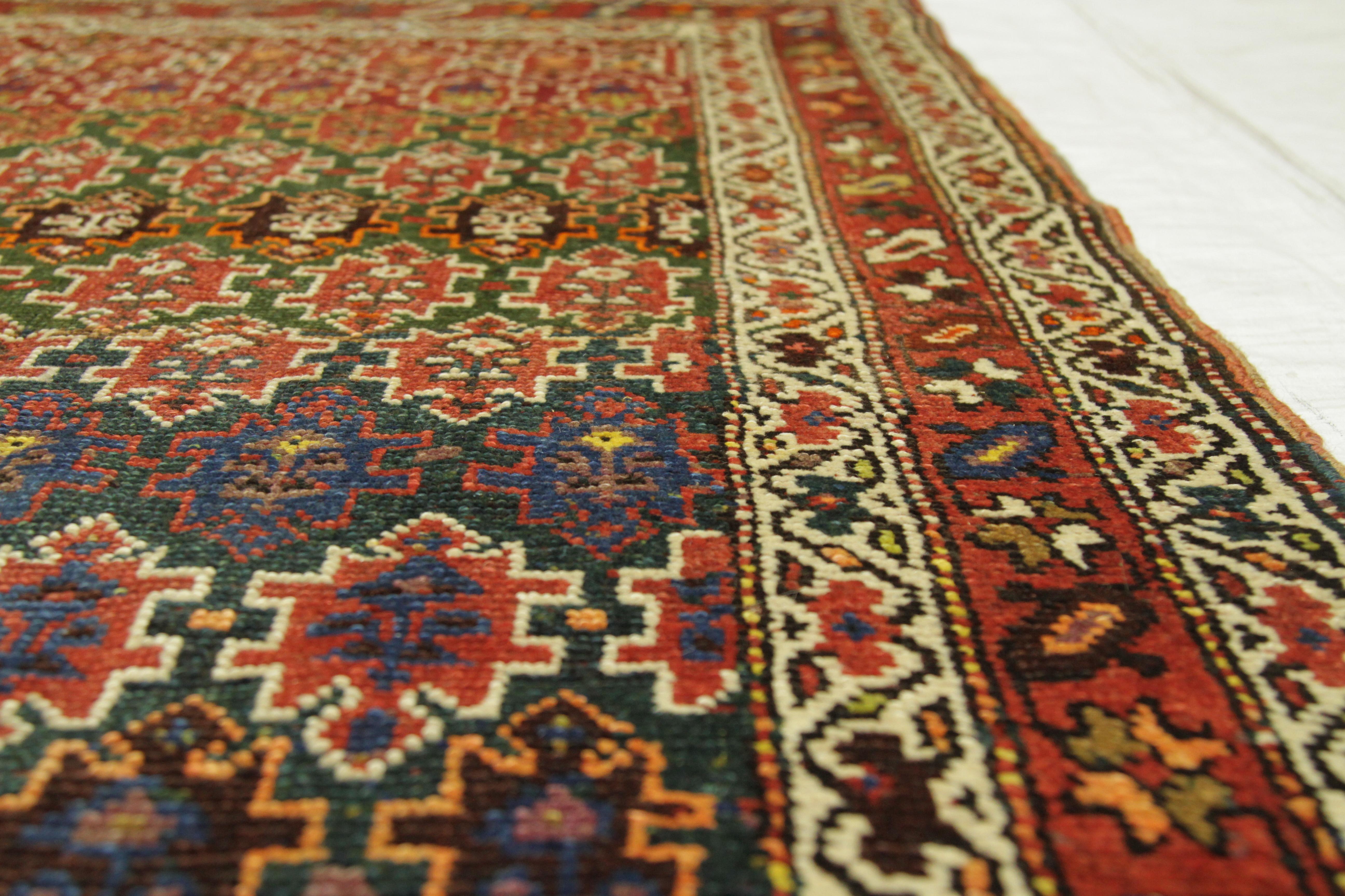 Early 20th Century Antique Persian Rug Azerbaijan Design with Vibrant Tribal Patterns, circa 1920s For Sale