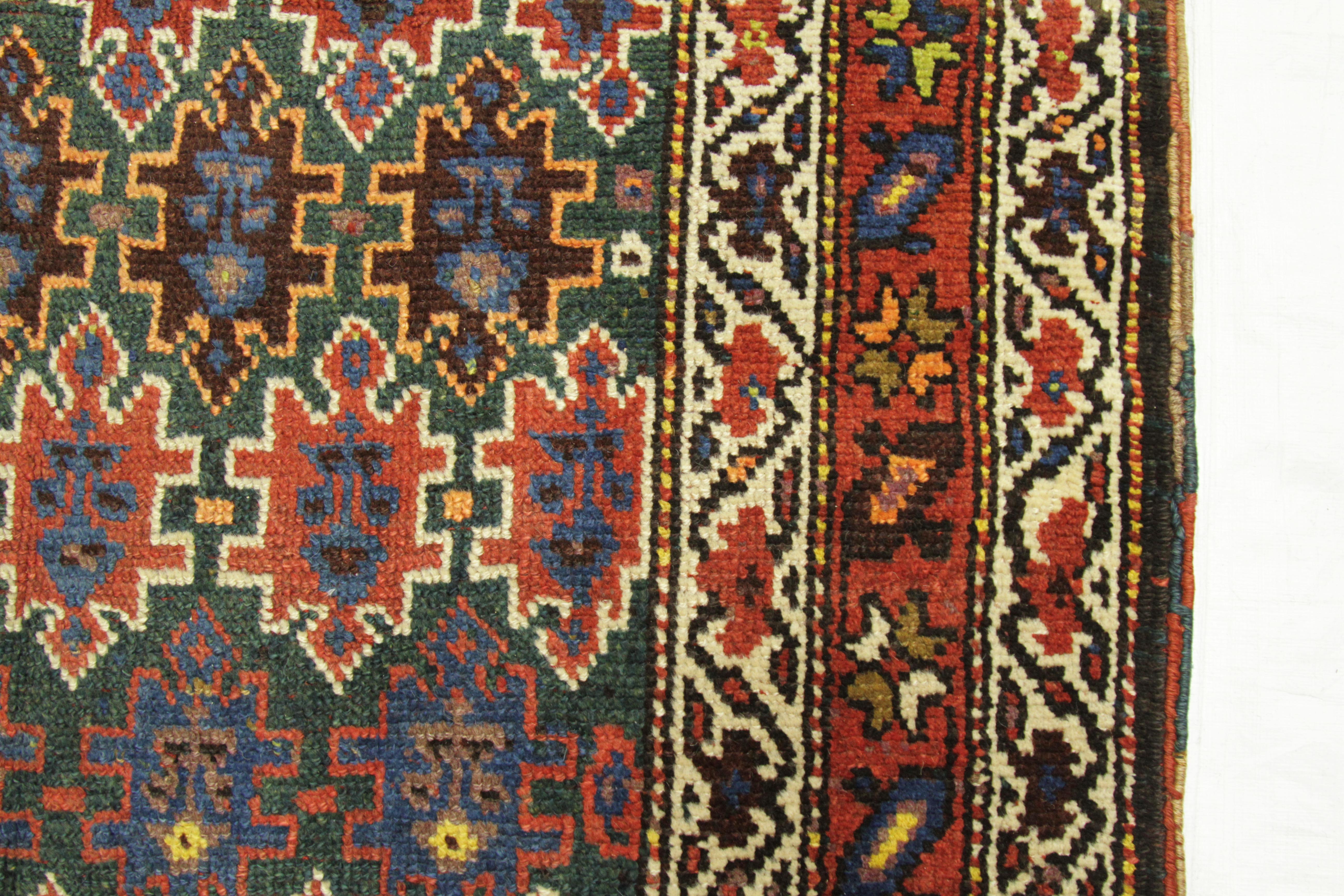 Antique Persian Rug Azerbaijan Design with Vibrant Tribal Patterns, circa 1920s For Sale 1