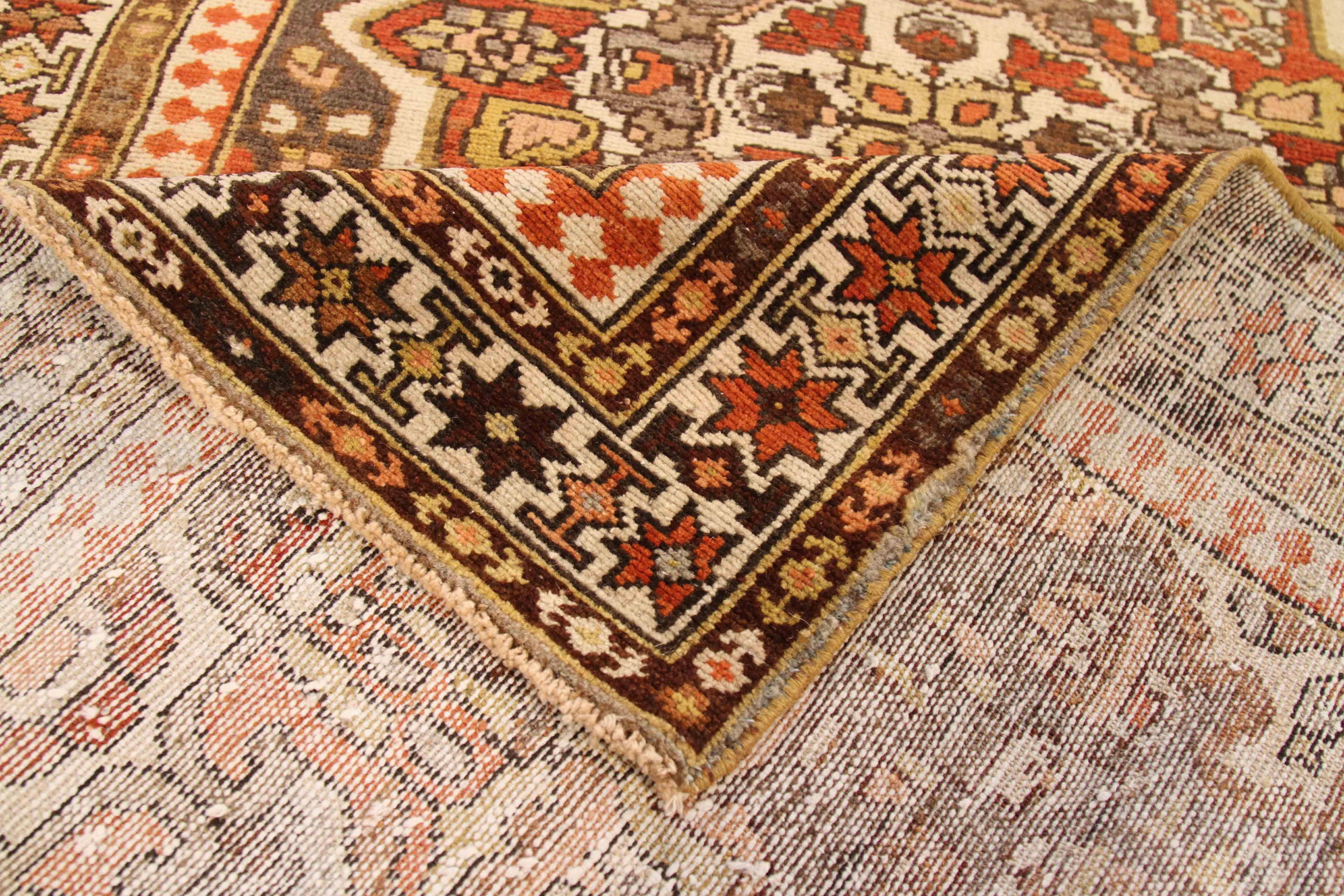 Made from luxurious handspun wool, this antique Persian rug was woven by artisans who have mastered traditional Bakhtiari weaving styles. It features a highly detailed floral theme bordered by equally ornate star figures. It’s a great option for