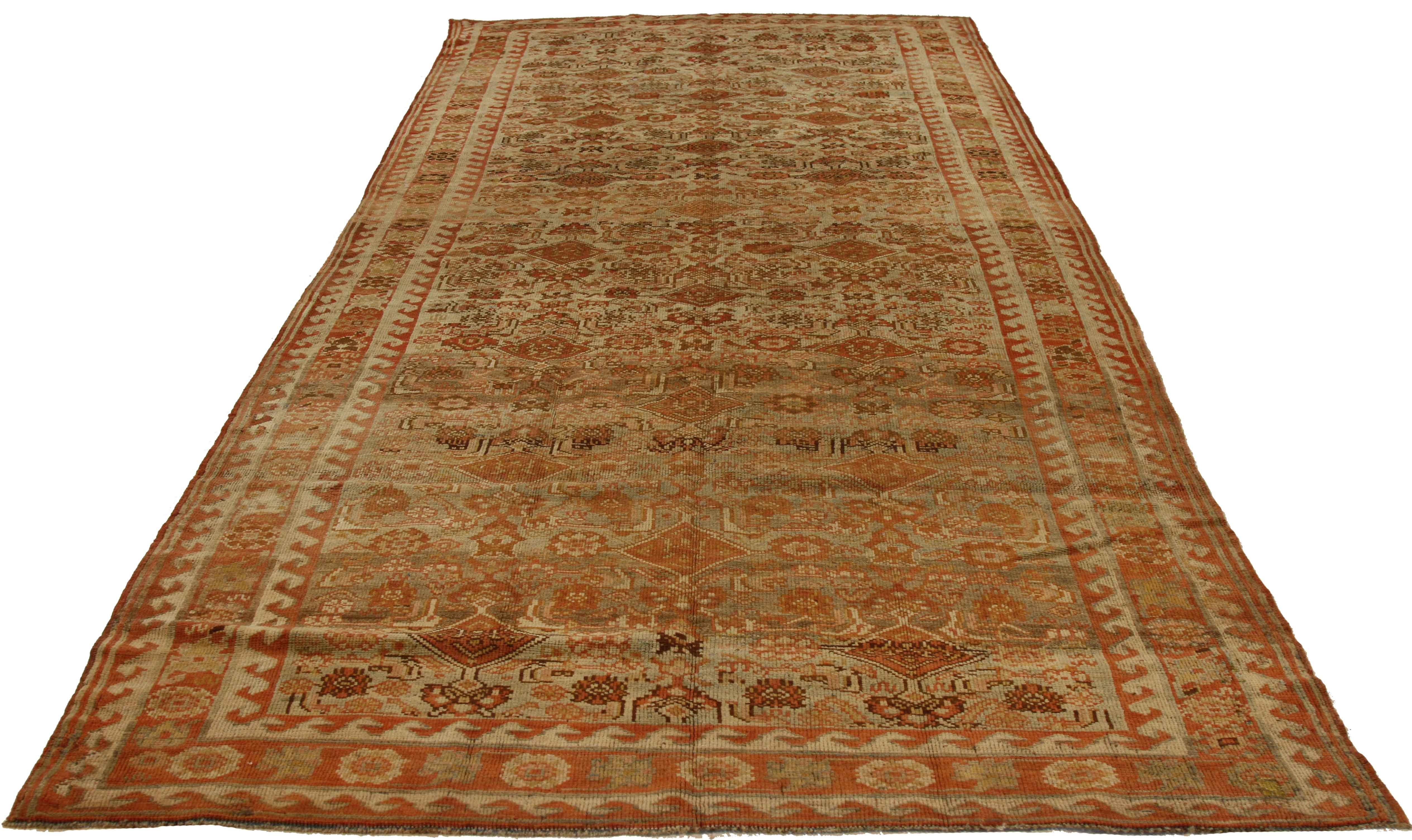 Made from the finest handspun wool and organic plant-based dyes, this antique Persian rug was created in the 1930s using weaving details commonly associated with Bijar weavers. The motif is traditionally centered on nature and animal symbols which