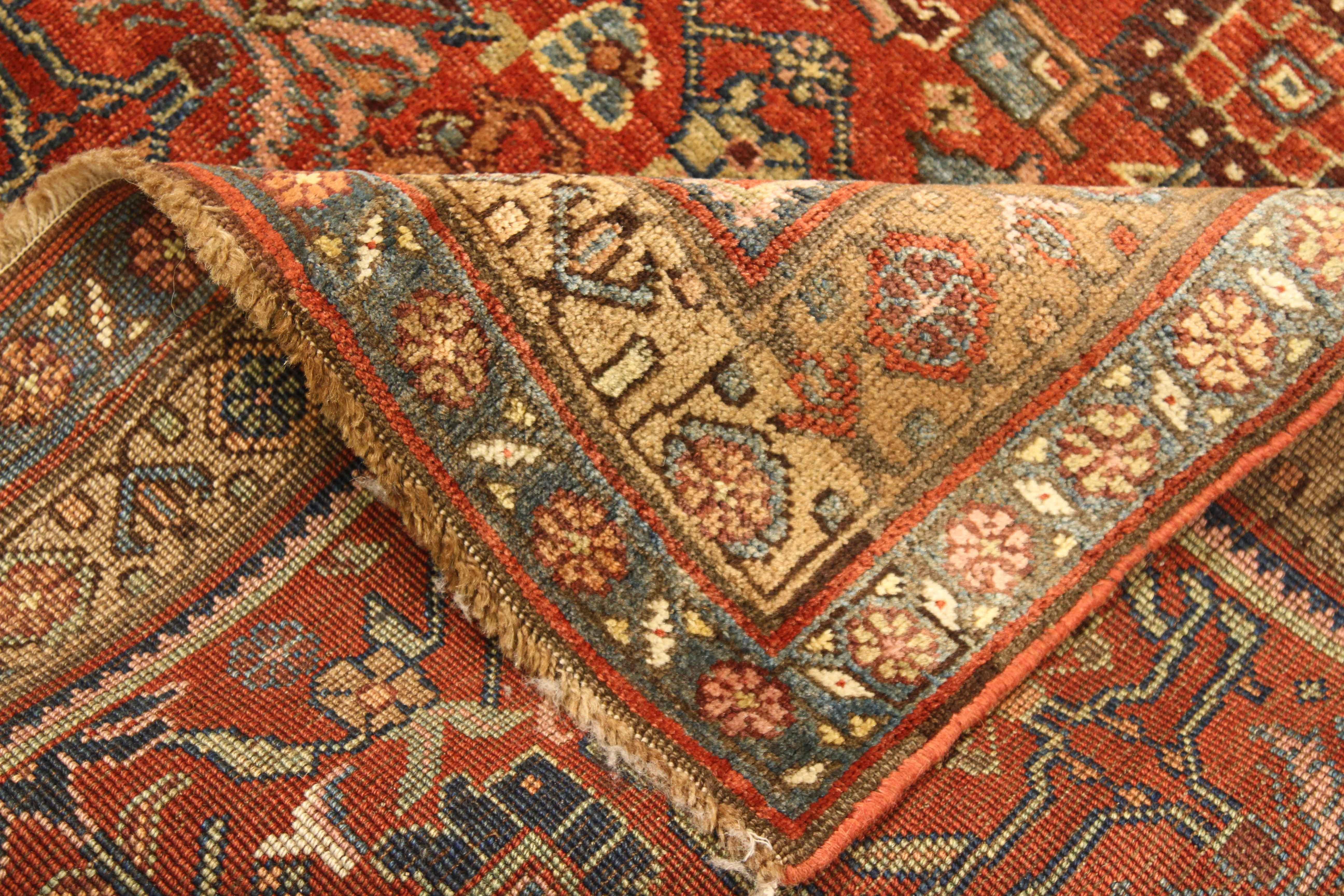 Antique Persian rug handwoven from the finest sheep’s wool and colored with all-natural vegetable dyes that are safe for humans and pets. It’s a traditional Bijar design featuring floral details in red, pink, green and brown. It’s a beautiful piece