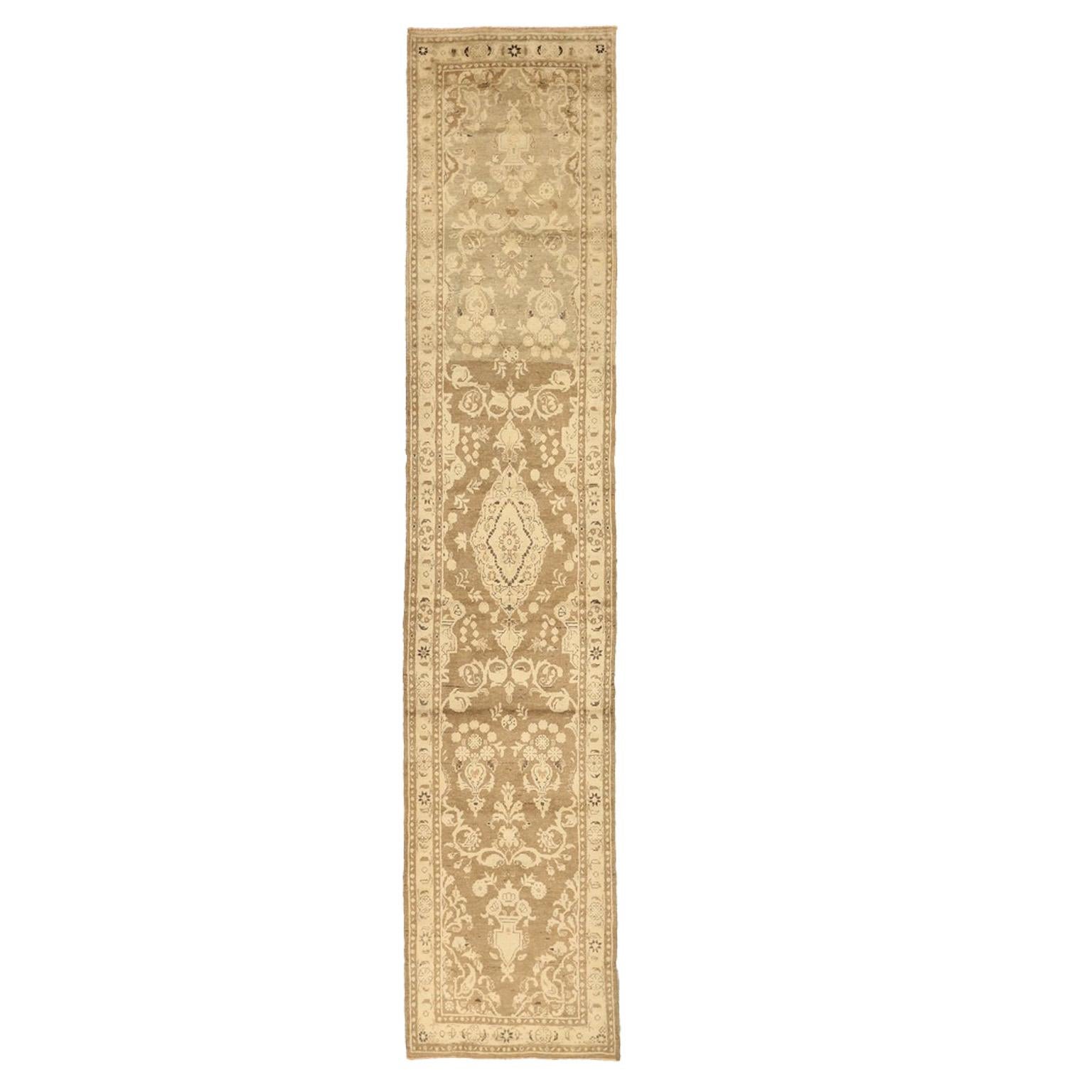Antique Persian rug handwoven from the finest wool. It features elaborate floral and nature patterns Hamadan weavers are famous for. It's color palette shows an elegant blend of green and brown hues that will look gorgeous in contemporary and