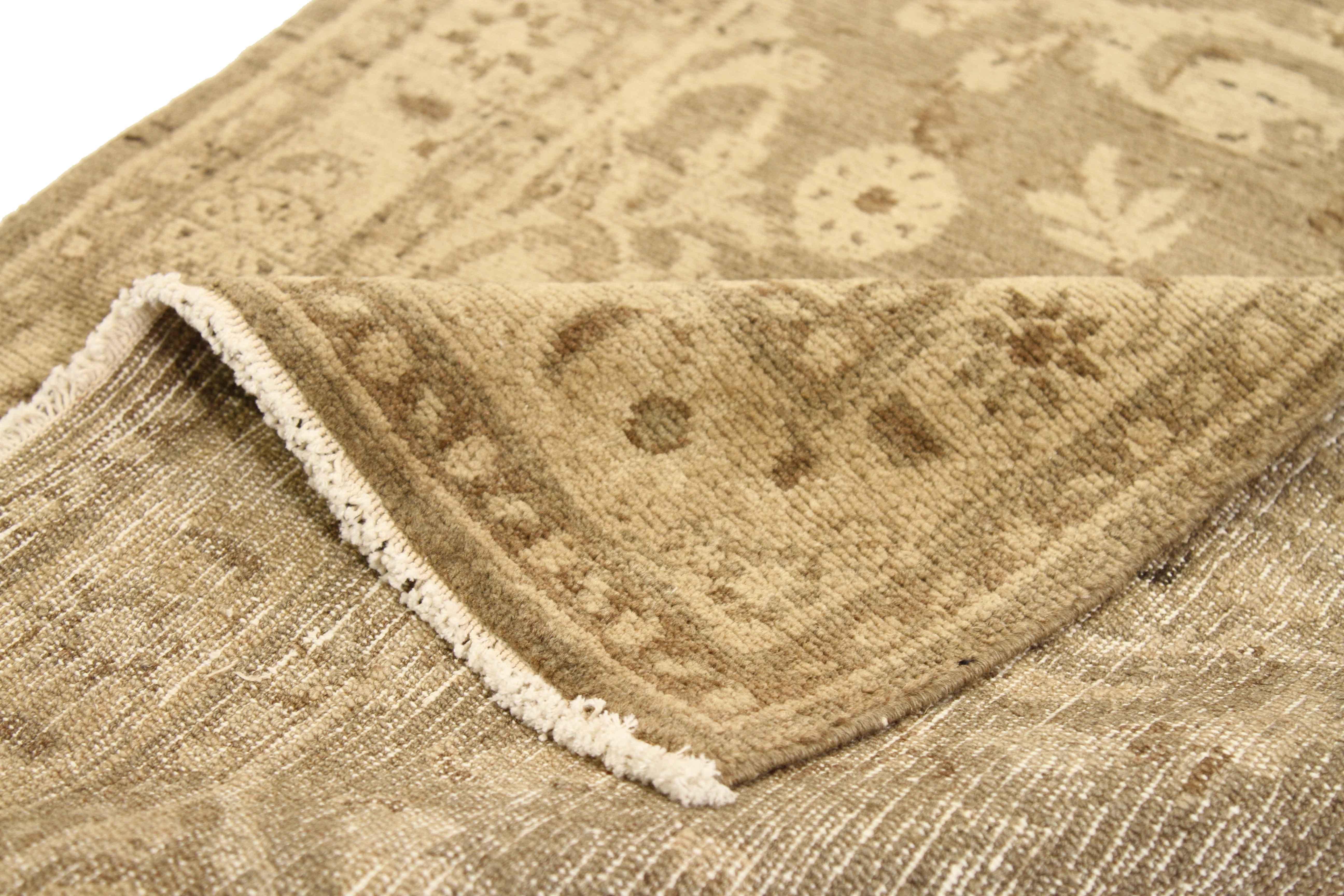 Made from the finest quality of natural wool and vegetable dye, this antique Persian rug is certified organic and eco-friendly. Its muted brown and beige color mix is perfect for coastal or Hamptons-style homes as well as rustic and shabby chic