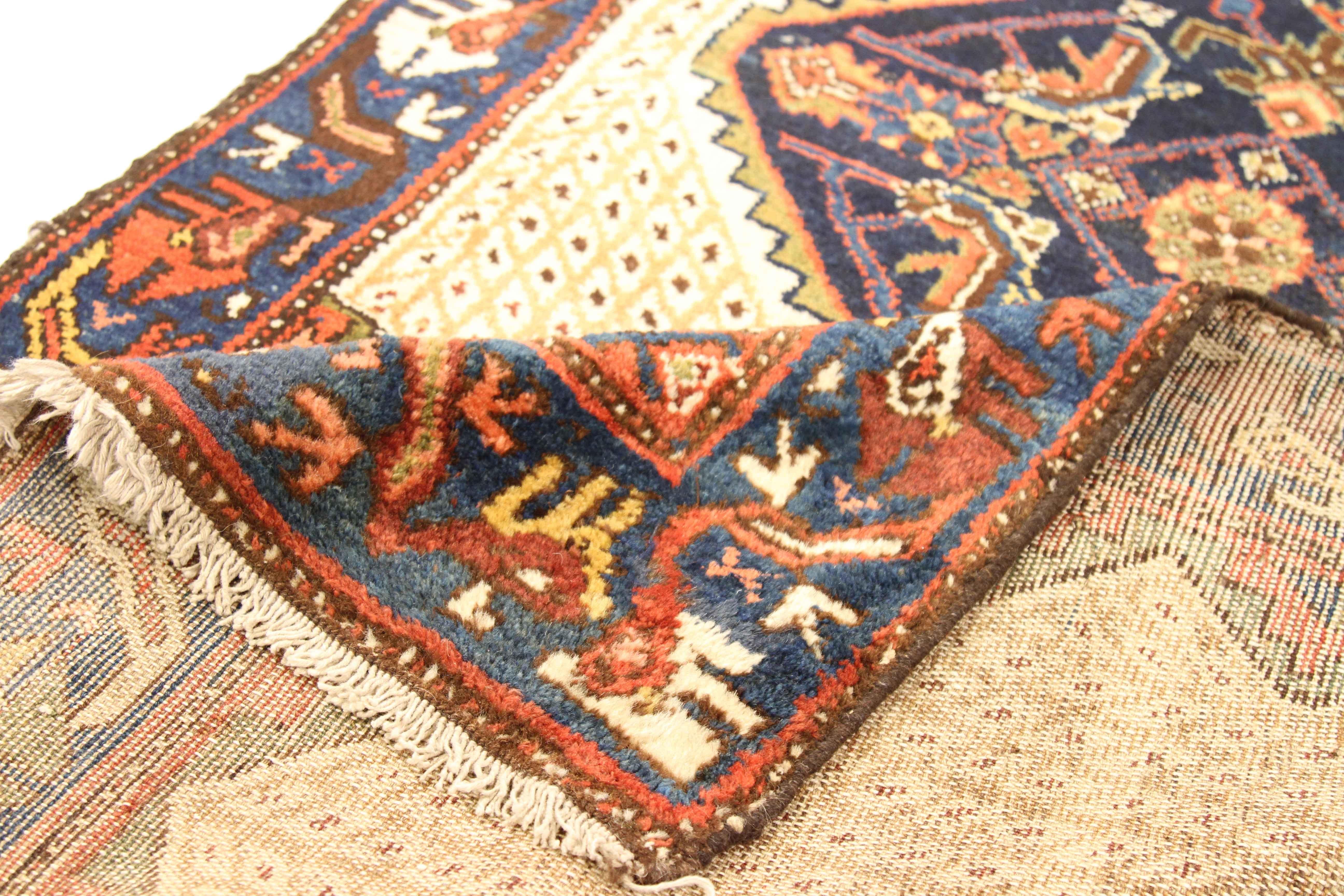 Made of the finest wool and vegetable dyes, this antique Persian rug follows a design made popular by weavers in the ancient Persian city of Malayer. Tribal patterns infused with nature elements became the trademark for Malayers just like this