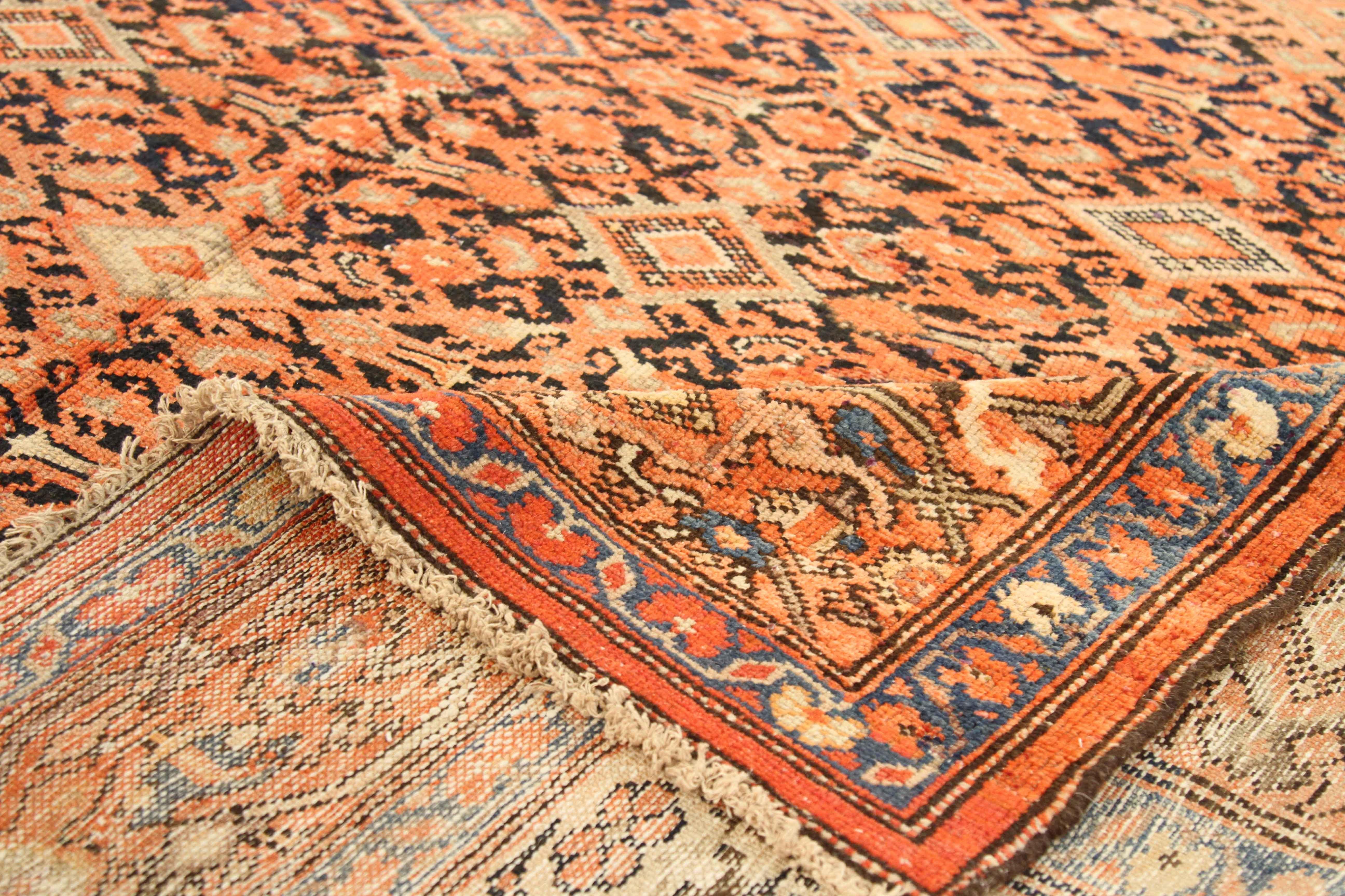 Antique Persian rug made of the finest quality of wool and organic vegetable dyes. It features a large medallion figure on the centre field filled with smaller geometric figures. Around it, the borders boast of floral patterns traditionally used by