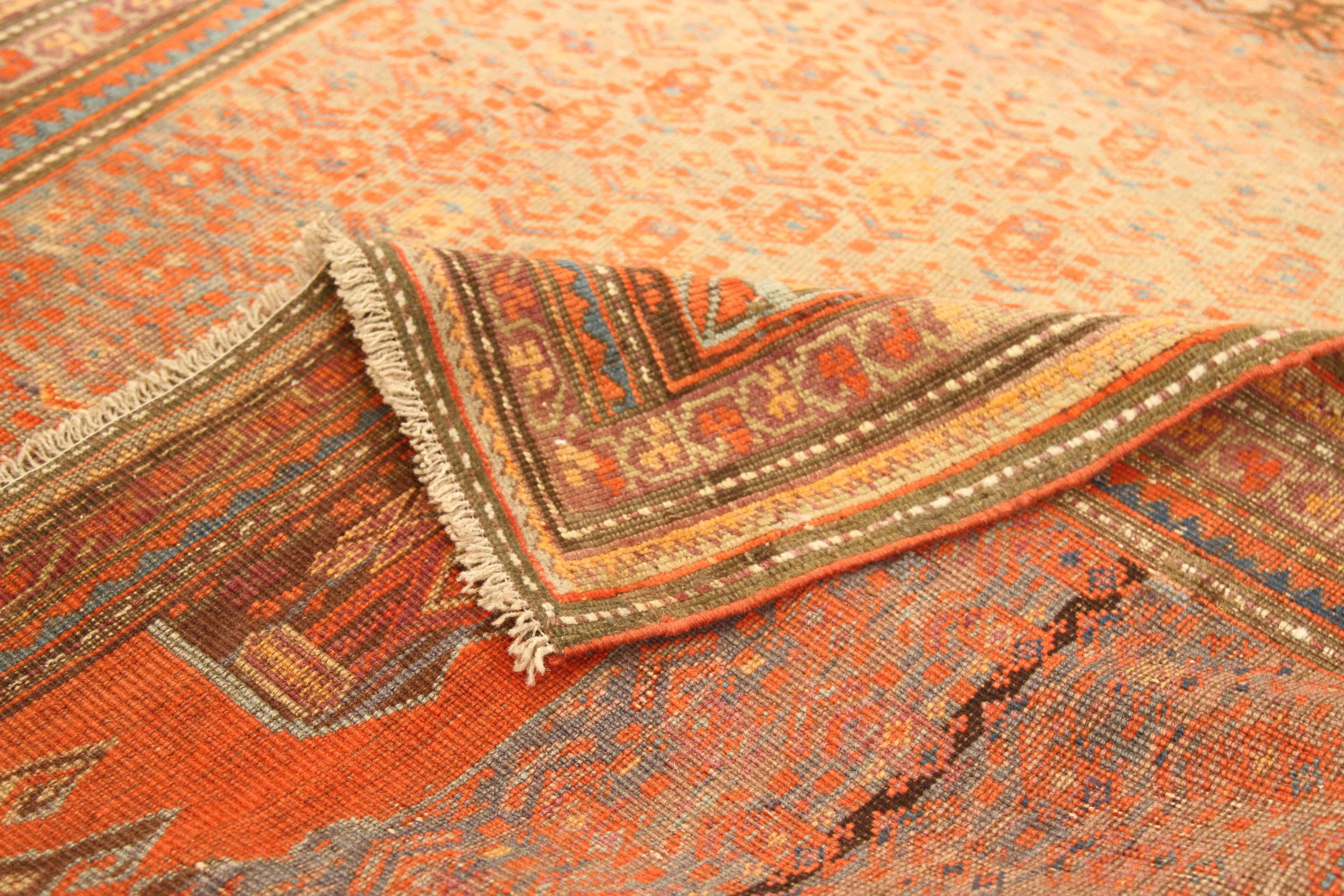 Antique Persian rug crafted from handspun wool and the highest grade of vegetable dyes. It features traditional geometric patterns with sleek fading from the creative minds of Meshkin master weavers. The lovely mix of beige, red, yellow and blue