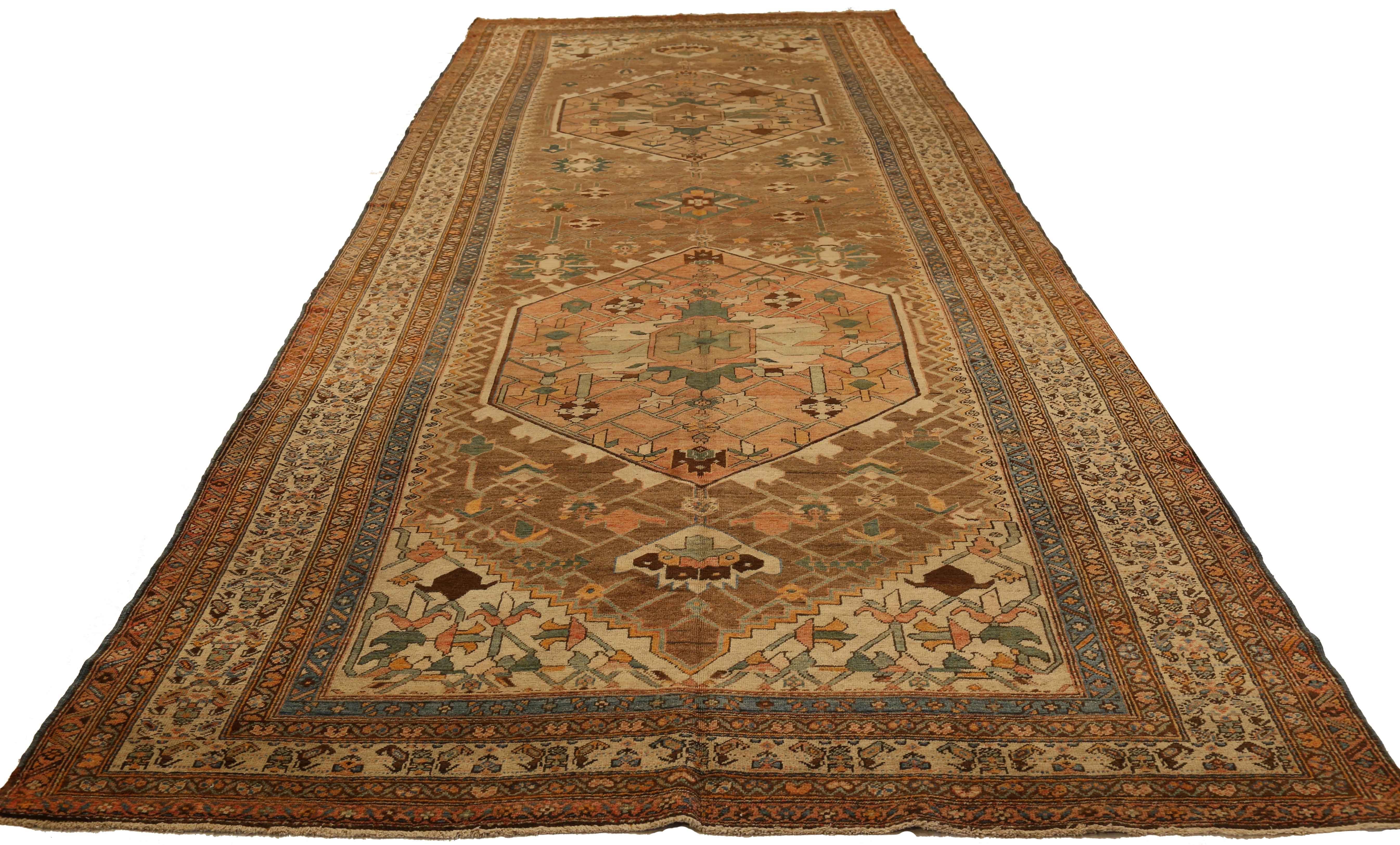 Antique Persian Rug Serapi Design in Green and Brown Tribal Details, circa 1920s In Excellent Condition For Sale In Dallas, TX