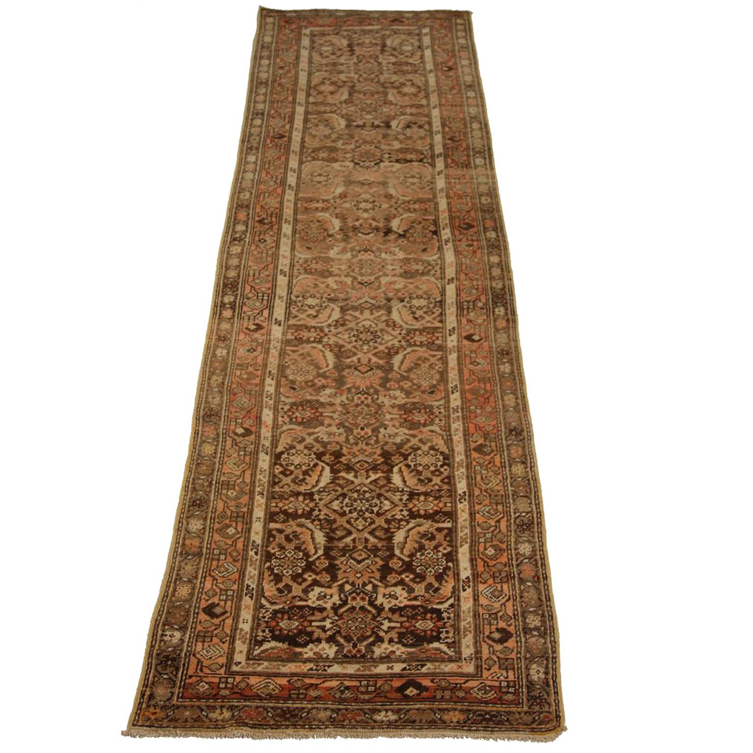 Made from handspun wool of the finest grade, this antique Persian rug has its entire body covered in Zanjan style design patterns. Its black, orange and brown color mix lends it an air of royalty which is a great fit for contemporary and Mid-Century